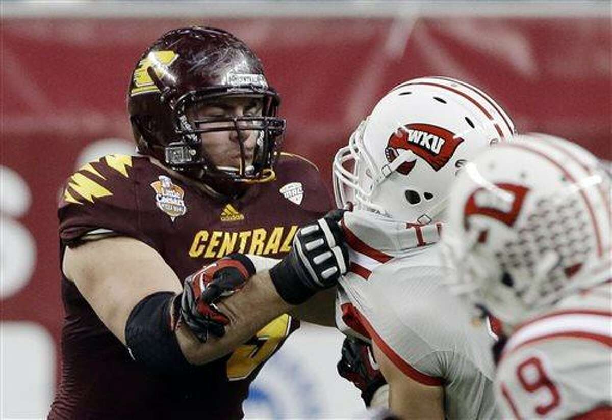 FILE - In this Dec. 26, 2012, file photo, Central Michigan offensive linesman Eric Fisher blocks against Western Kentucky during the second half of the Little Caesars Pizza Bowl NCAA college football game at Ford Field in Detroit. Only twice since the AFL-NFL merger in 1970 has an offensive tackle been drafted first overall. (AP Photo/Carlos Osorio, File)