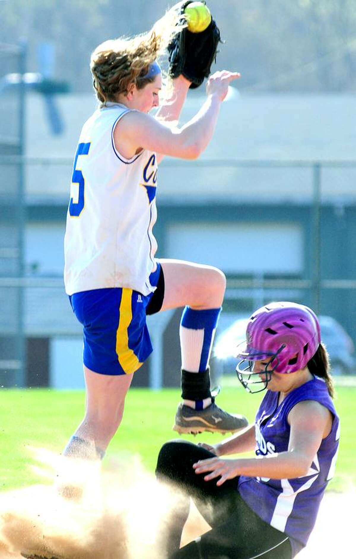 Sabrina Lemere (bottom) of North Branford is safe as Lauren McCann of Haddam-Killingworth fields a throw to second on 4/24/2013.Photo by Arnold Gold/New Haven Register