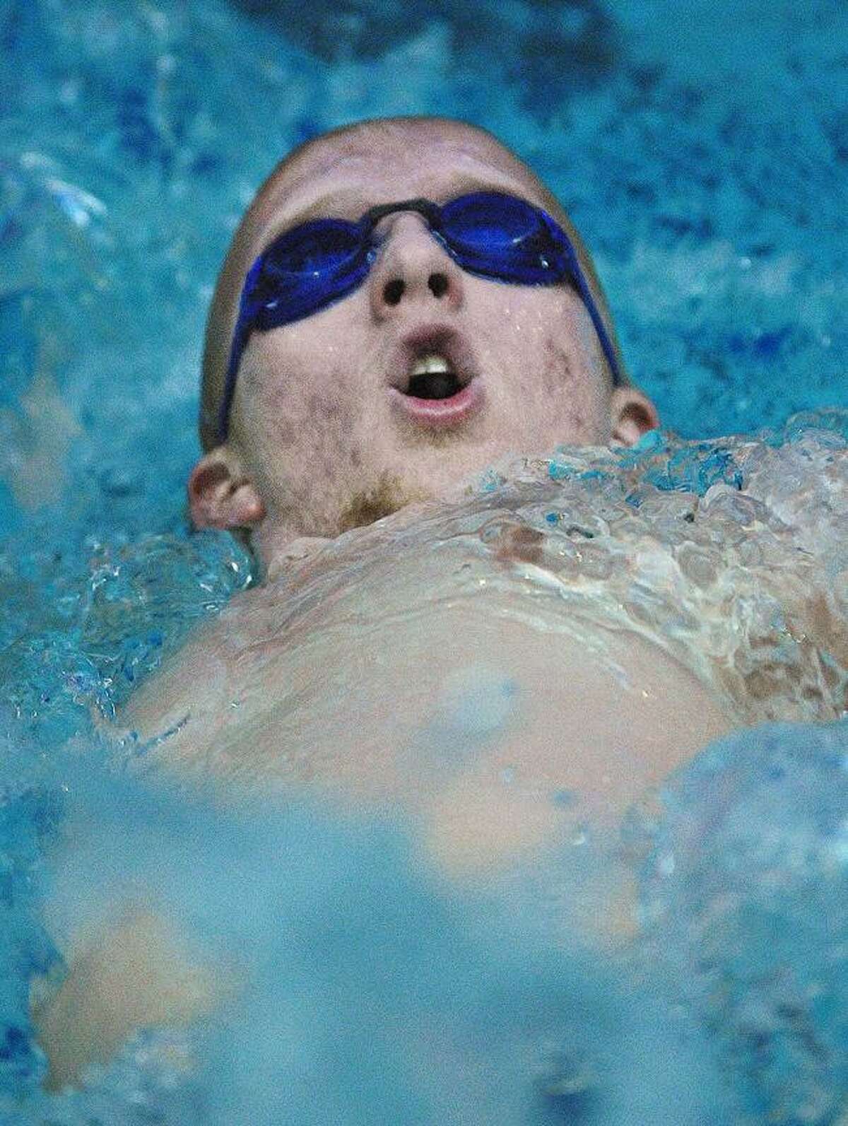 Catherine Avalone/The Middletown PressMiddletown senior Willie Molski 100 backstroke places first against Berlin at the Baldwin-Parmelee pool at MHS Wednesday afternoon. The Middletown Blue Dragons defeated the Berlin Redcoats 100-74.