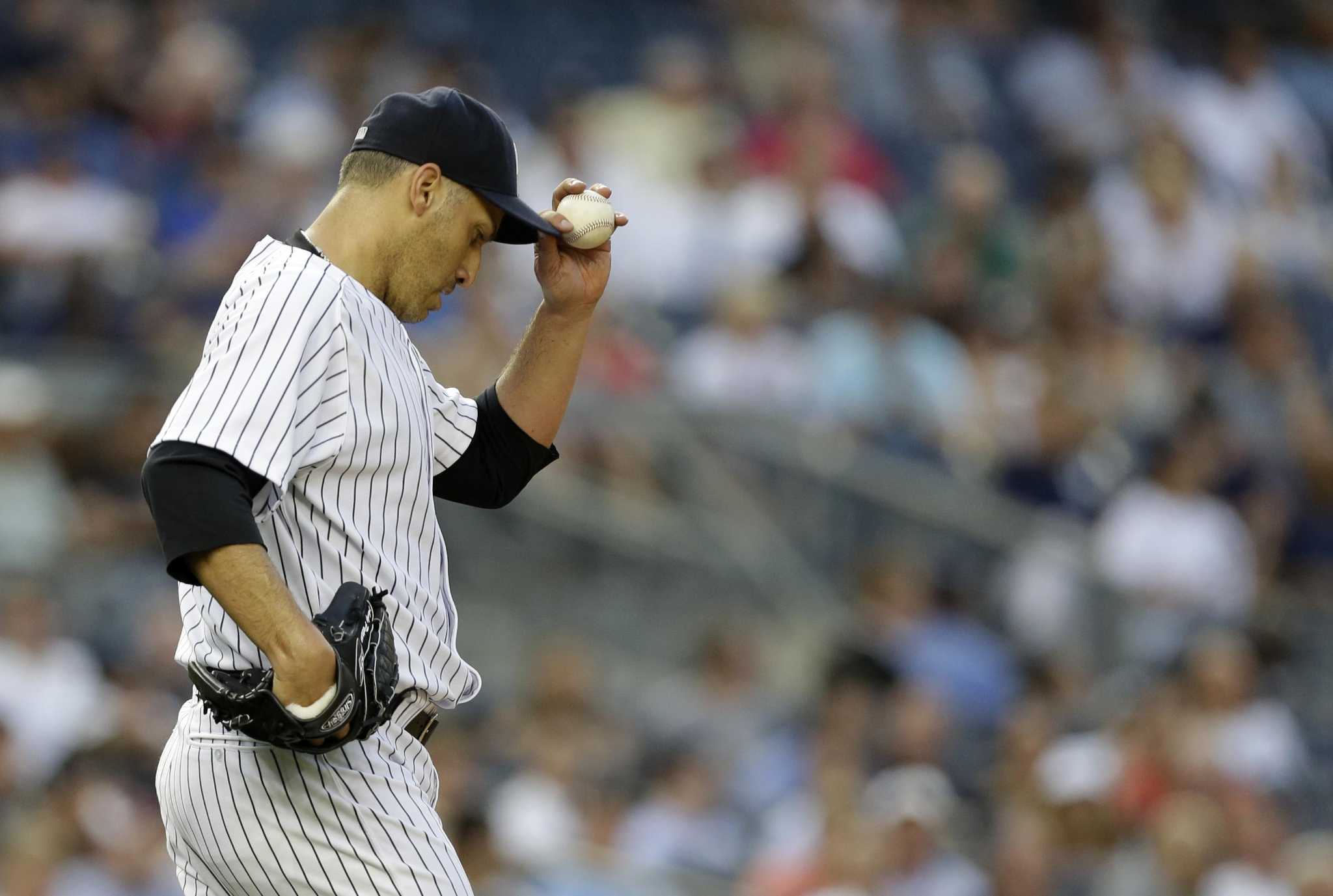 Andy Pettitte earns the 250th win of his career with 7 1/3 innings