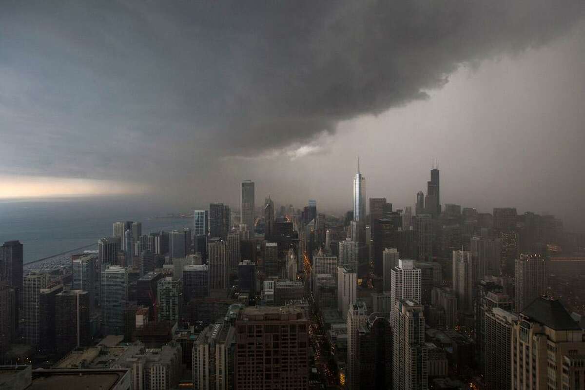 A thunderstorm with heavy rains approaches downtown Chicago, Monday, June 24, 2013. (AP Photo/Scott Eisen)