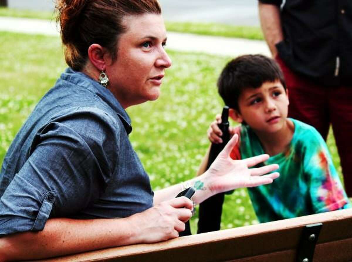 Left, Jessica Chiong with her son right, Hunter Chiong talk to a small group outside of West Haven City Hall about the protest against the Common Core Curriculum on 06/24/2013. Nicole Dellolio/ For the Register
