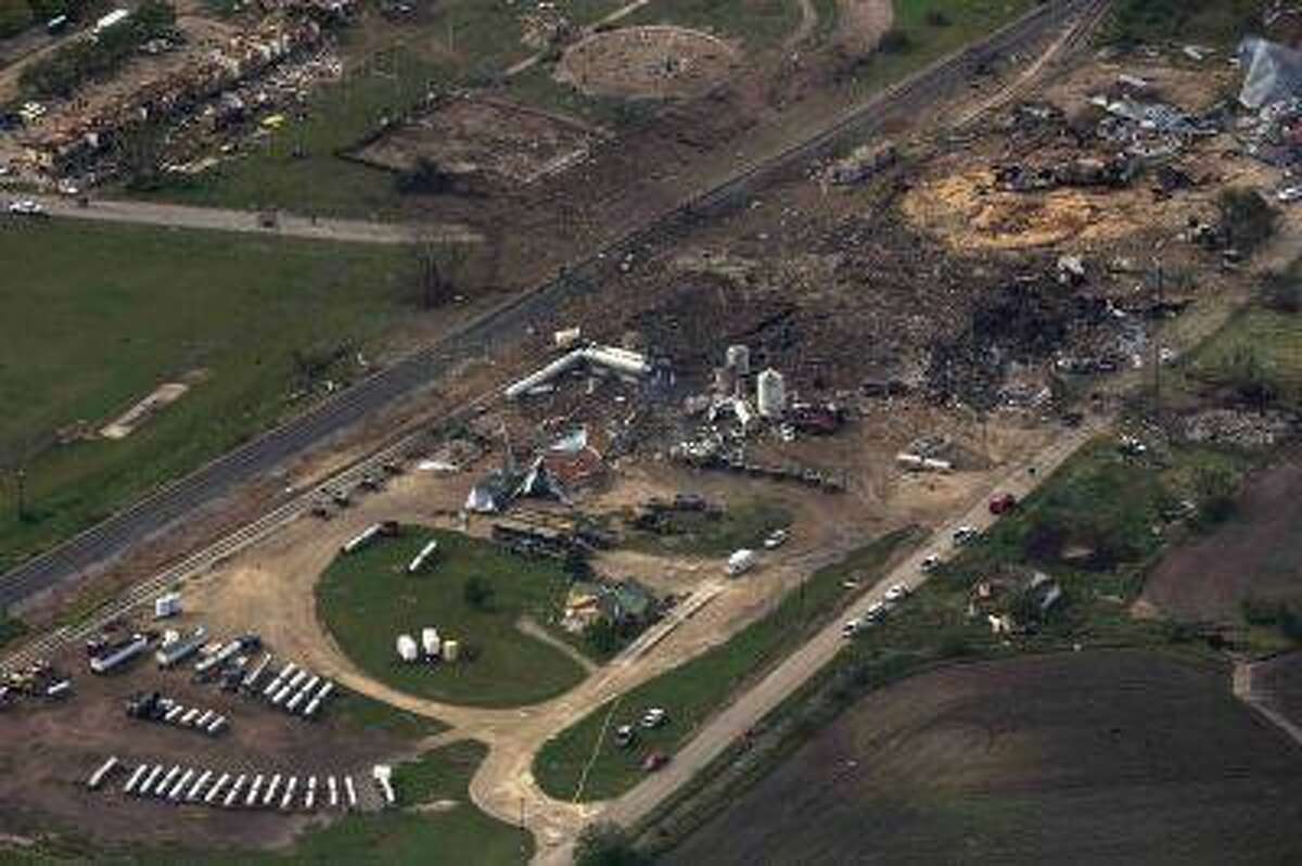 An aerial view shows the aftermath of a massive explosion at a fertilizer plant in the town of West, near Waco, Texas April 18, 2013. The death toll in explosion at the plant has reached 14 people, Mayor Tommy Muska said on Thursday. Among the 14 are four emergency medical technicians killed in the blast, which occurred on Wednesday evening after emergency responders rushed to put out a fire at the plant. REUTERS/Adrees Latif (UNITED STATES - Tags: DISASTER ENVIRONMENT AGRICULTURE)