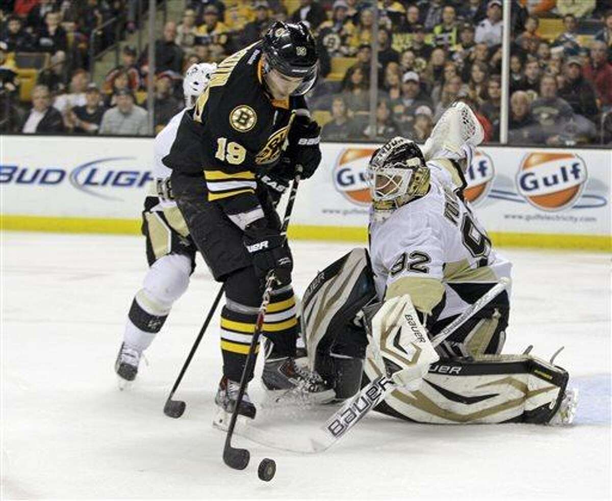 Pittsburgh Penguins goalie Tomas Vokoun (92) makes a stick save on a shot attempt by Boston Bruins center Tyler Seguin (19) during the second period of an NHL hockey game Saturday, April 20, 2013, in Boston. (AP Photo/Mary Schwalm)