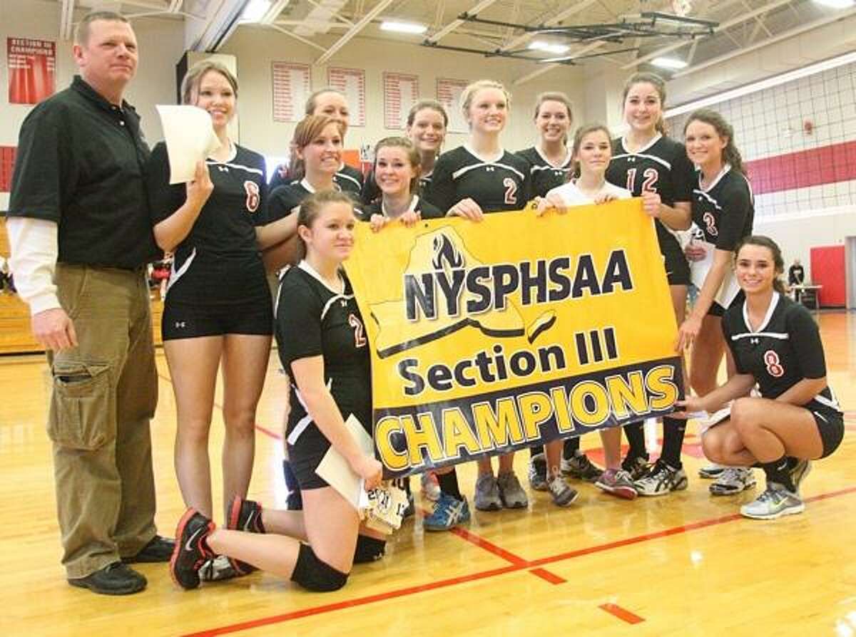 Dispatch Staff Photo by JOHN HAEGER twitter.com/oneidaphoto M-E players pose with their banner after sweeping Dolgeville to win the Class C-2 girls volleyball title on Saturday, Feb. 16, 2013 in Chittenango.