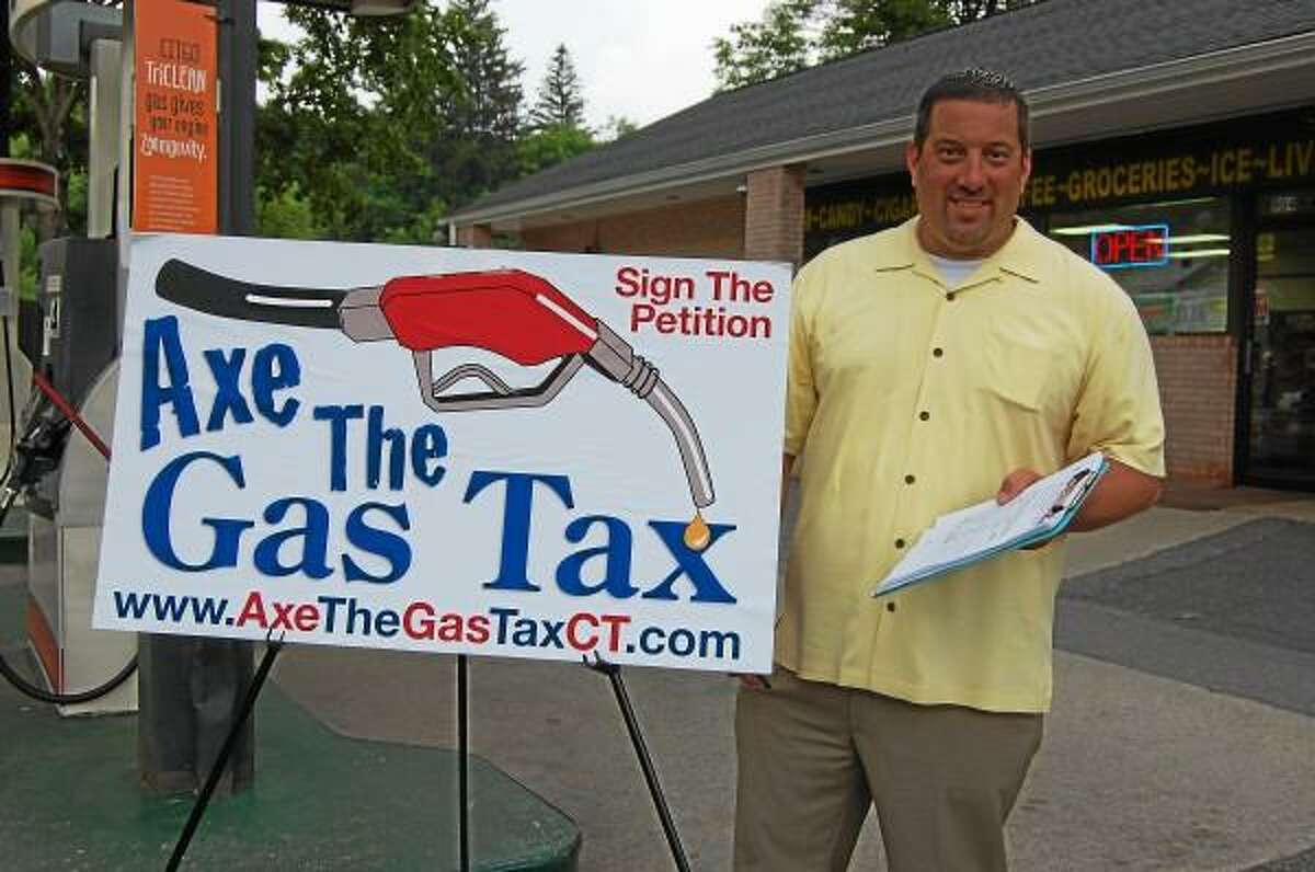 State Rep. Jay Case petitions against a gas tax hike in Winsted on June 24. (Mercy Quaye-Register Citizen)