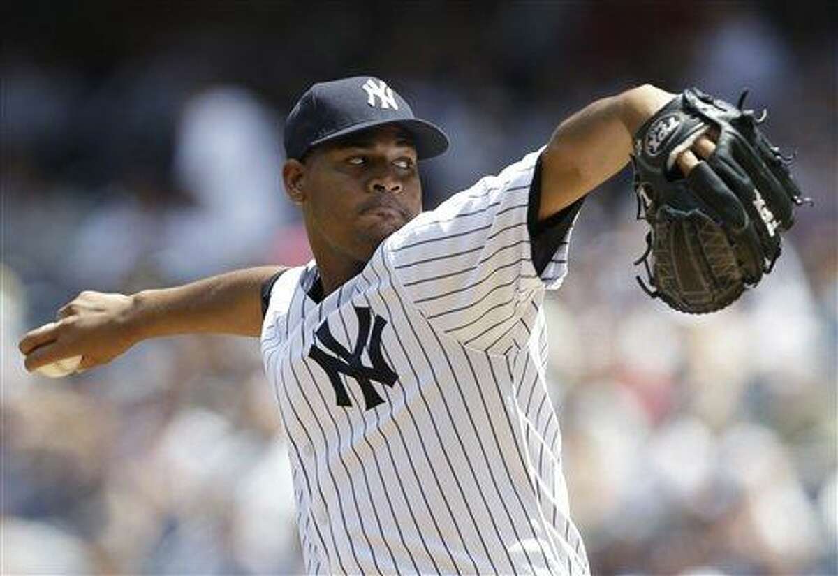 New York Yankees starting pitcher Ivan Nova delvers in the first inning against the Tampa Bay Rays in a baseball game Sunday, June 23, 2013, in New York. (AP Photo/Kathy Willens)