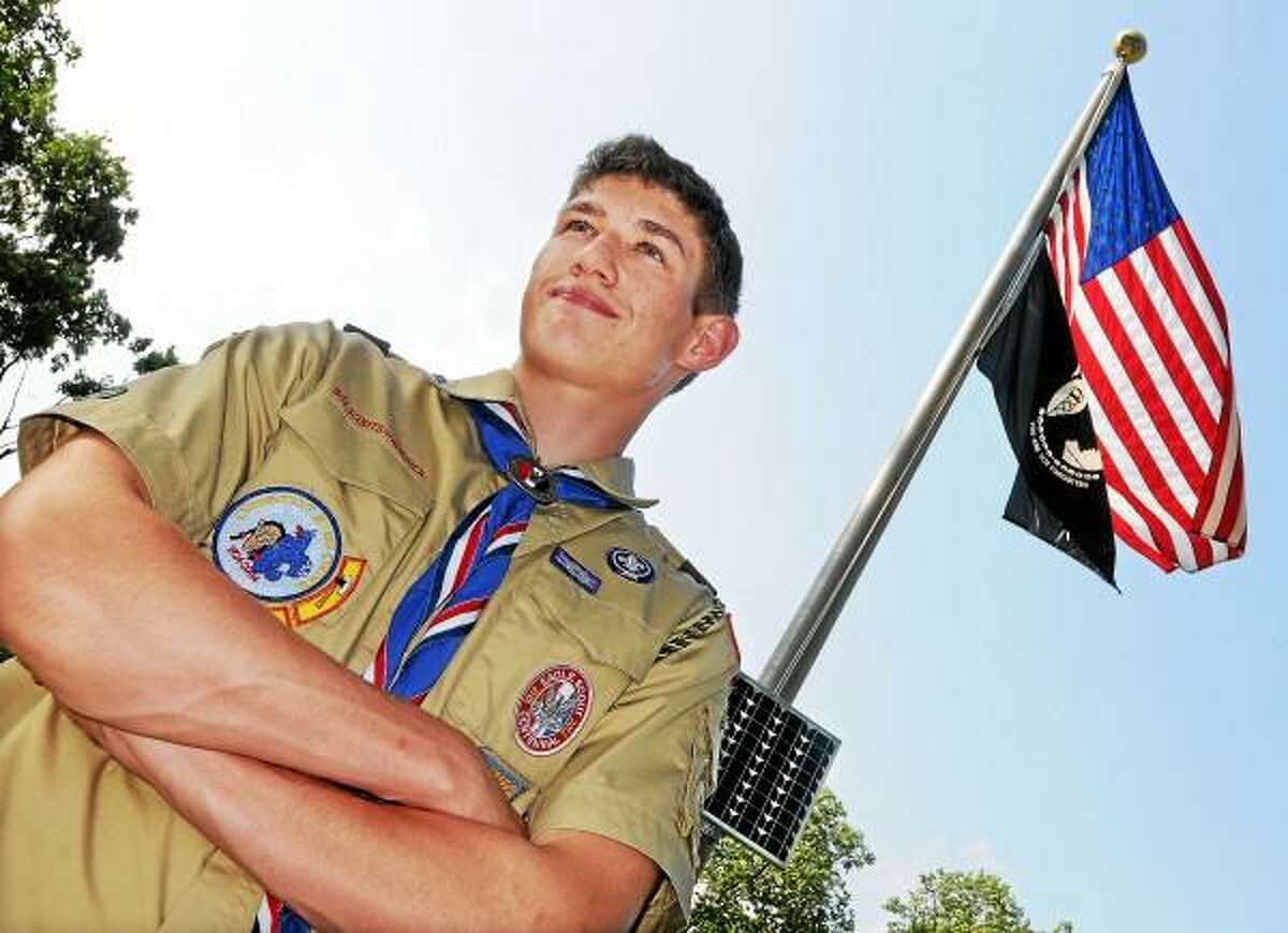 Catherine Avalone/The Middletown Press Middletown resident Tom Boller, 16, an Eagle Scout installed a solar panel to illuminate the American and Pow flags on the Washington Green for his Eagle Scout Service Project. Boller enlisted help from his fellow scouts at Troop 41 chartered by St. Mary Church and members of American Legion Post 75. A rising senior at Middletown High School, Boller earned 37 merit badges and was honored at an Eagle Court of Honor held at St. Sebastian Church Sunday.