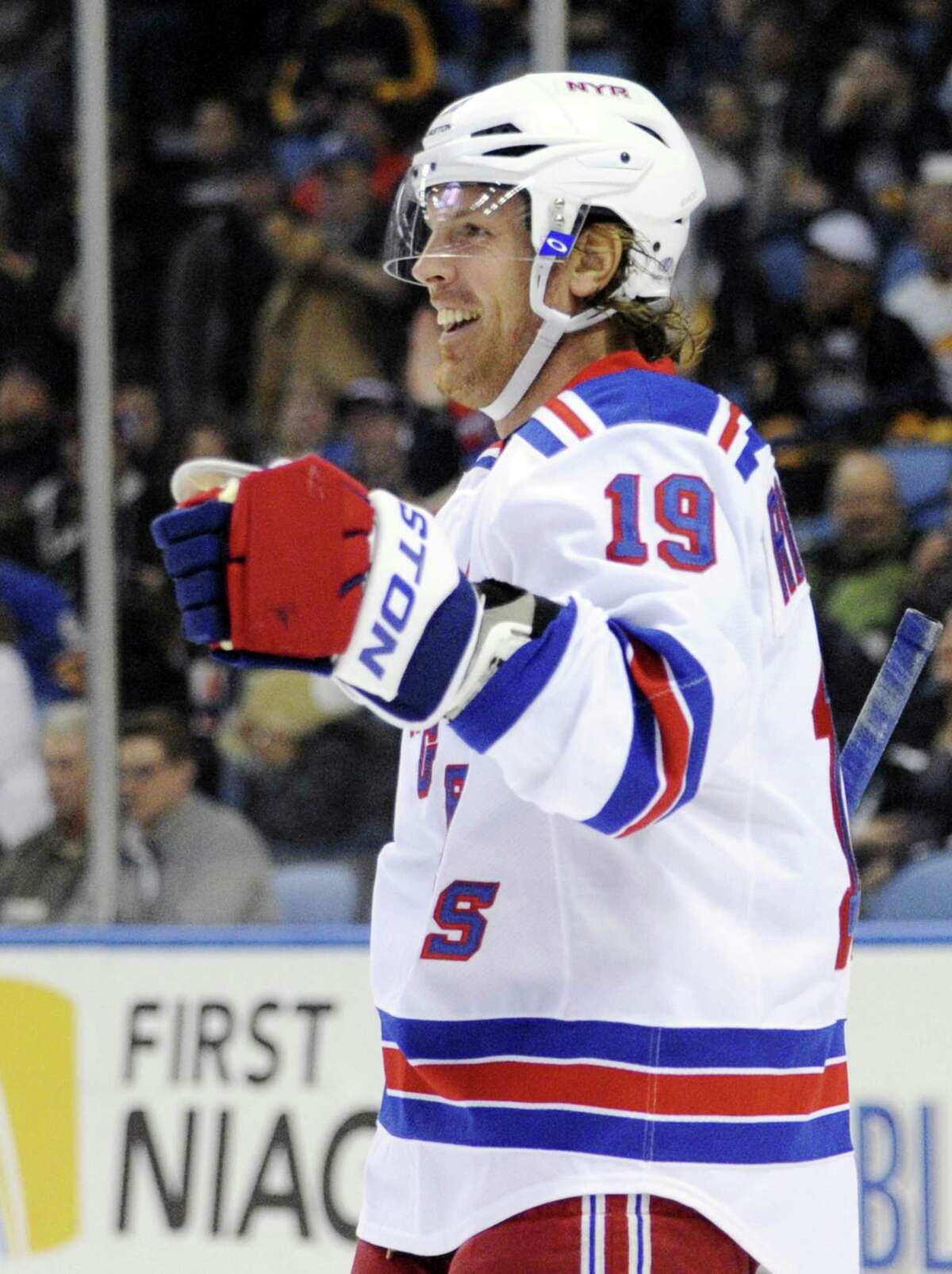 New York Rangers center Brad Richards celebrates his second of three goals against the Buffalo Sabres during the second period of an NHL hockey game in Buffalo, N.Y., Friday, April 19, 2013. New York won 8-4. (AP Photo/Gary Wiepert)