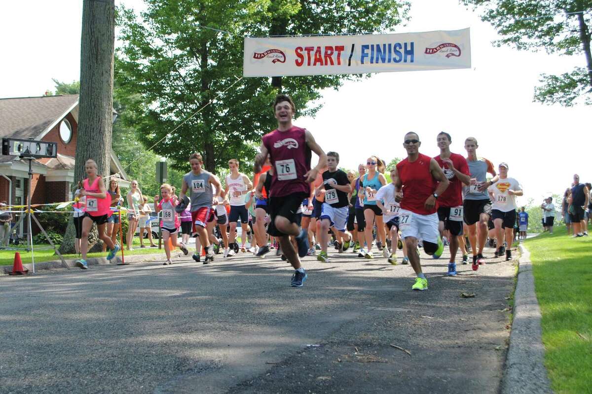 Runners start the Harwinton Road Race, a 3.4 mile course through the town. Jessica Glenza - Register Citizen