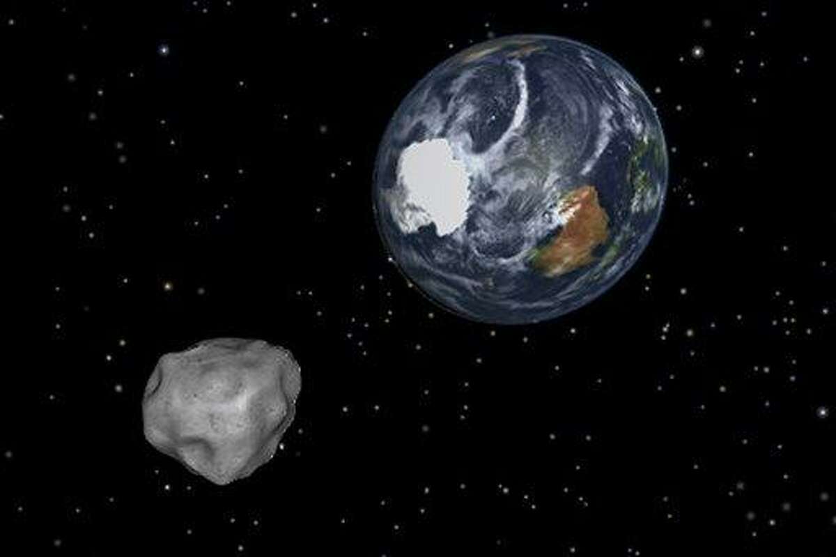 This image provided by NASA/JPL-Caltech shows a simulation of asteroid 2012 DA14 approaching from the south as it passes through the Earth-moon system on Friday, Feb. 15, 2013. The 150-foot object will pass within 17,000 miles of the Earth. NASA scientists insist there is absolutely no chance of a collision as it passes. (AP Photo/NASA/JPL-Caltech)