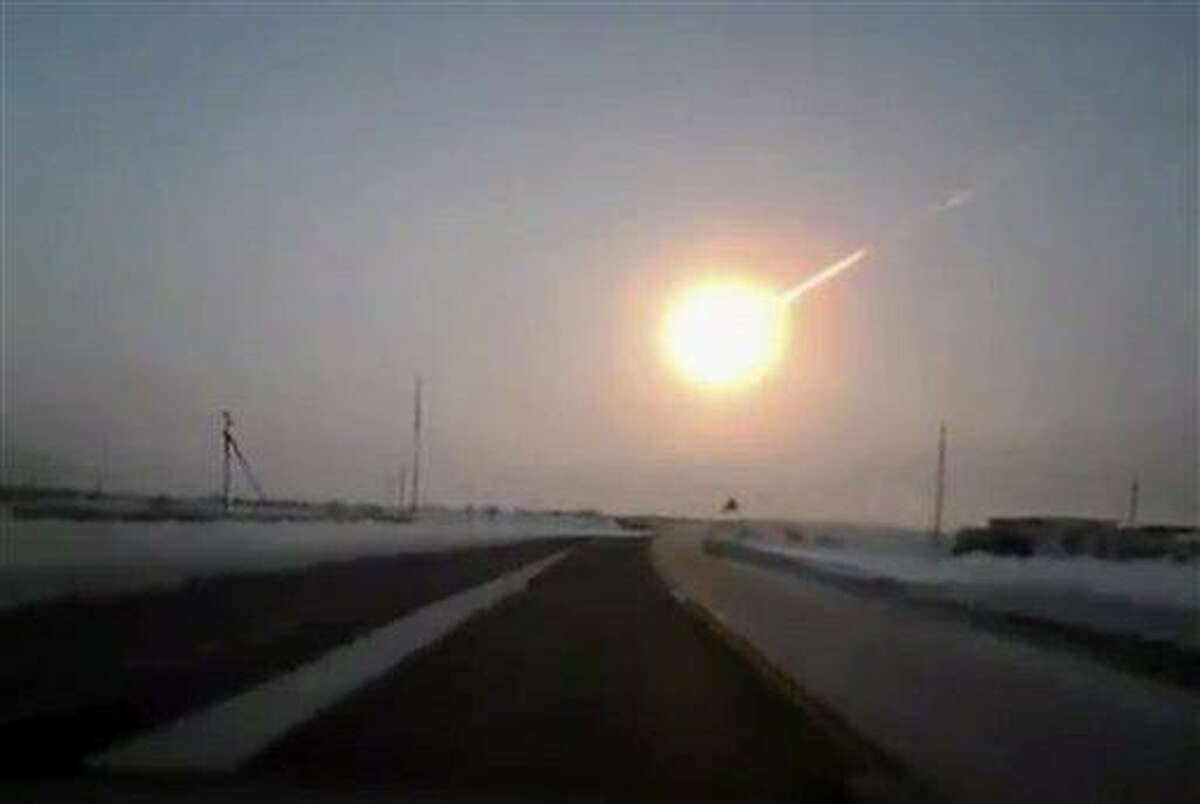 In this frame grab made from a video done with a dashboard camera, on a highway from Kostanai, Kazakhstan, to Chelyabinsk region, Russia, provided by Nasha Gazeta newspaper, on Friday, Feb. 15, 2013 a meteorite contrail is seen. A meteor streaked across the sky of Russia?s Ural Mountains on Friday morning, causing sharp explosions and reportedly injuring around 100 people, including many hurt by broken glass. (AP Photo/Nasha gazeta, www.ng.kz)