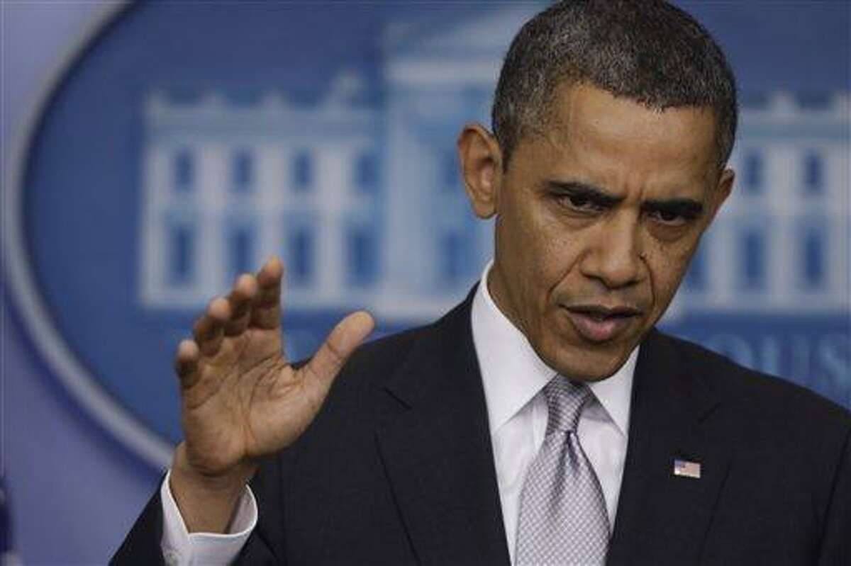 President Barack Obama gestures as he answers a question about the fiscal cliff in this file photo from last year. (AP Photo/Charles Dharapak)