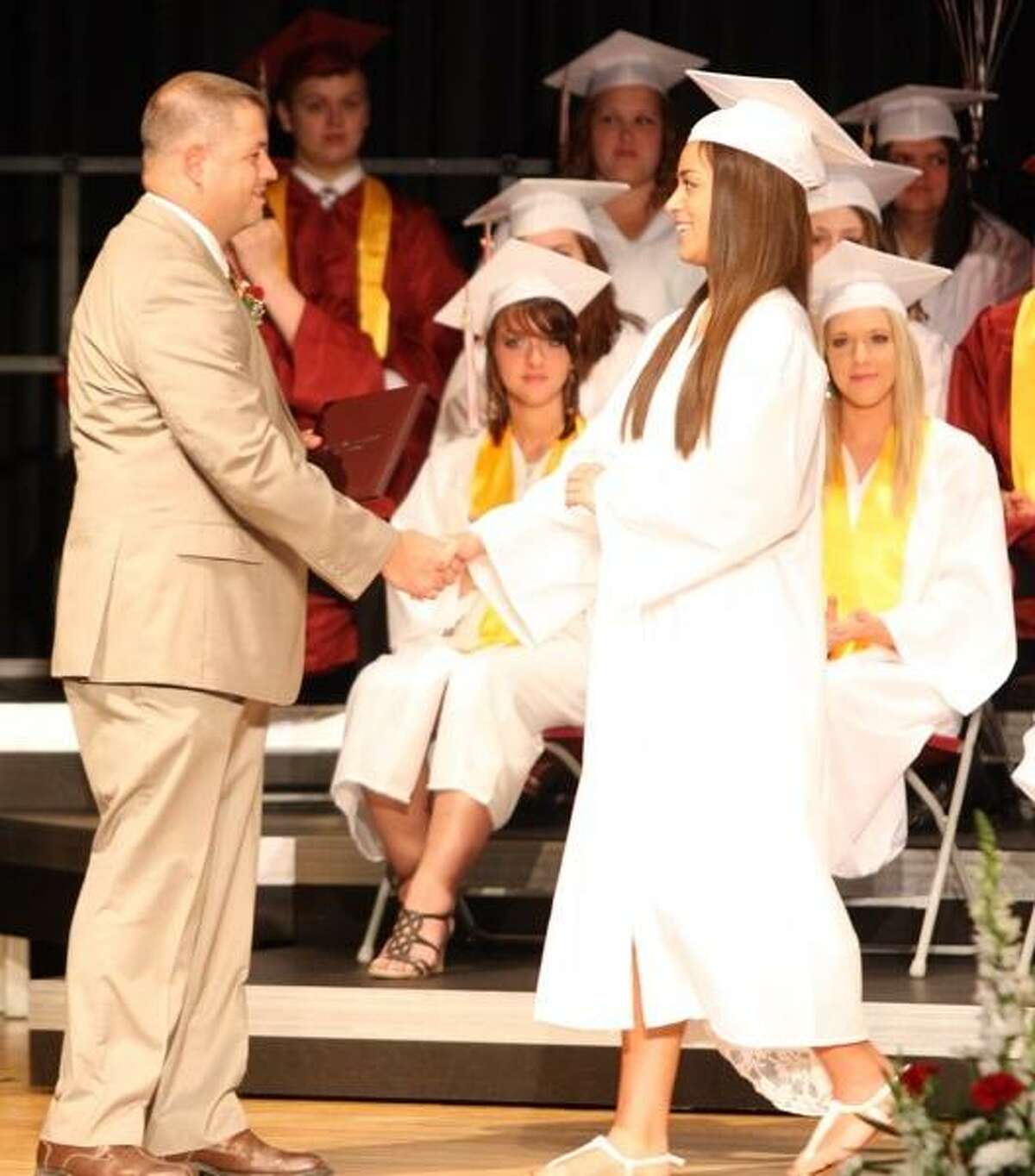 JOHN HAEGER @ONEIDAPHOTO ON TWITTER/ONEIDA DAILY DISPATCH Mariah Beauvais shakes the hand of Jacob Byron Board of Education President after receiving her diploma during 85th commencements at SVCS on Friday, June 21, 2013 in Munnsville.