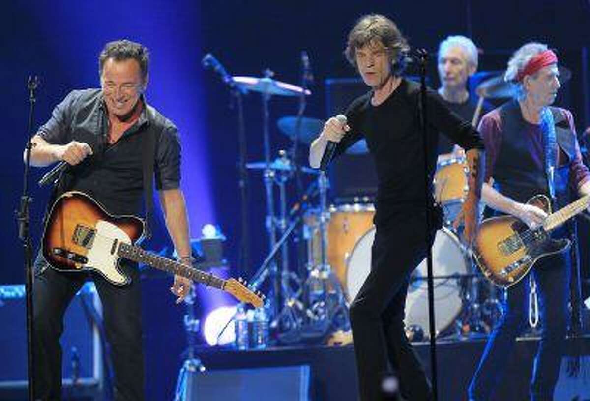 Mick Jagger (R) and Bruce Springsteen perform onstage during the Rolling Stones final concert of their "50 and Counting Tour" in Newark, N.J., December 15, 2012.