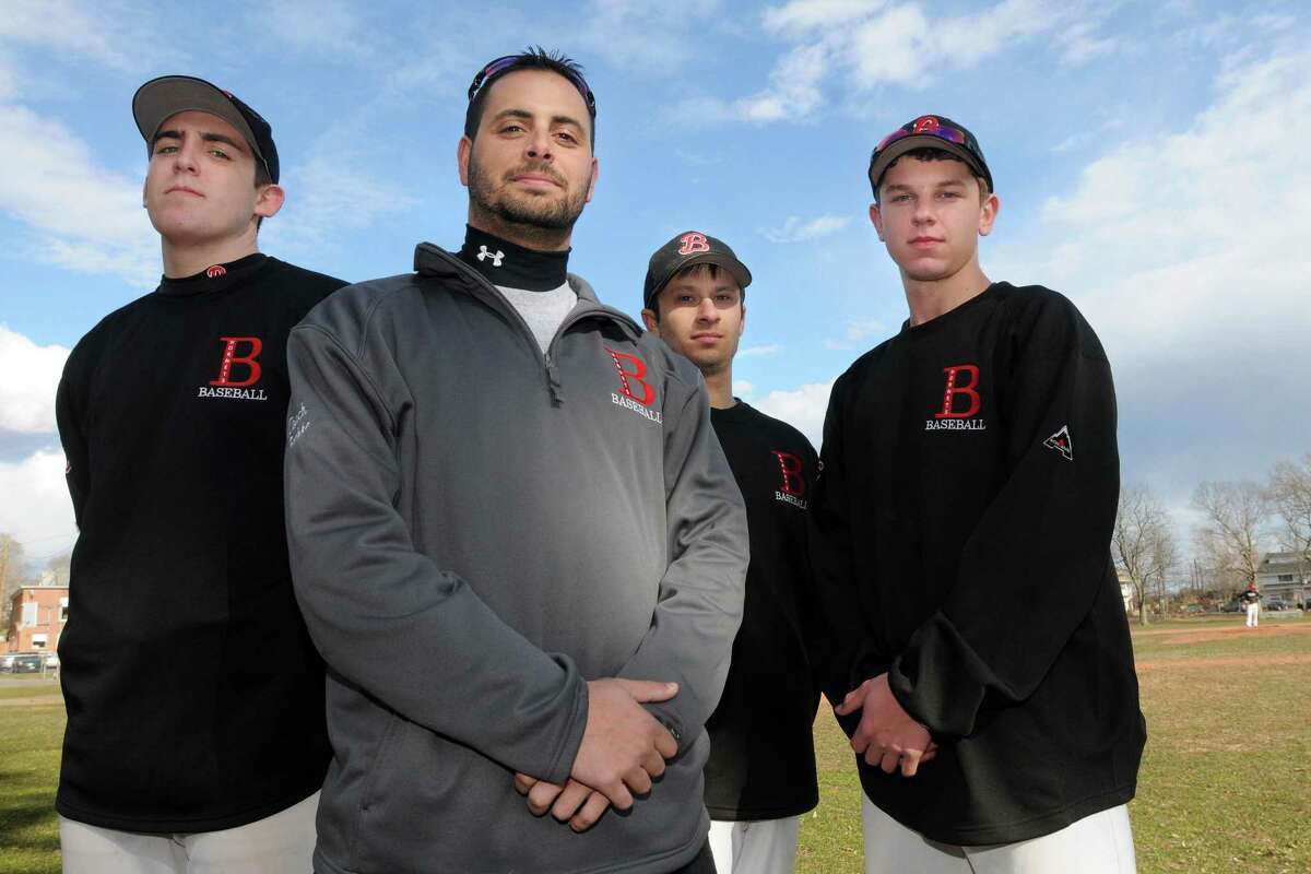 Branford baseball coach Ed Bethke (second from left) and captains, from left to right: Brad Doyle, Ed Bethke. Marc Canzanella, and Rob Petrillo, beat Foran 19-1 on Wednesday. Mara Lavitt/New Haven Register