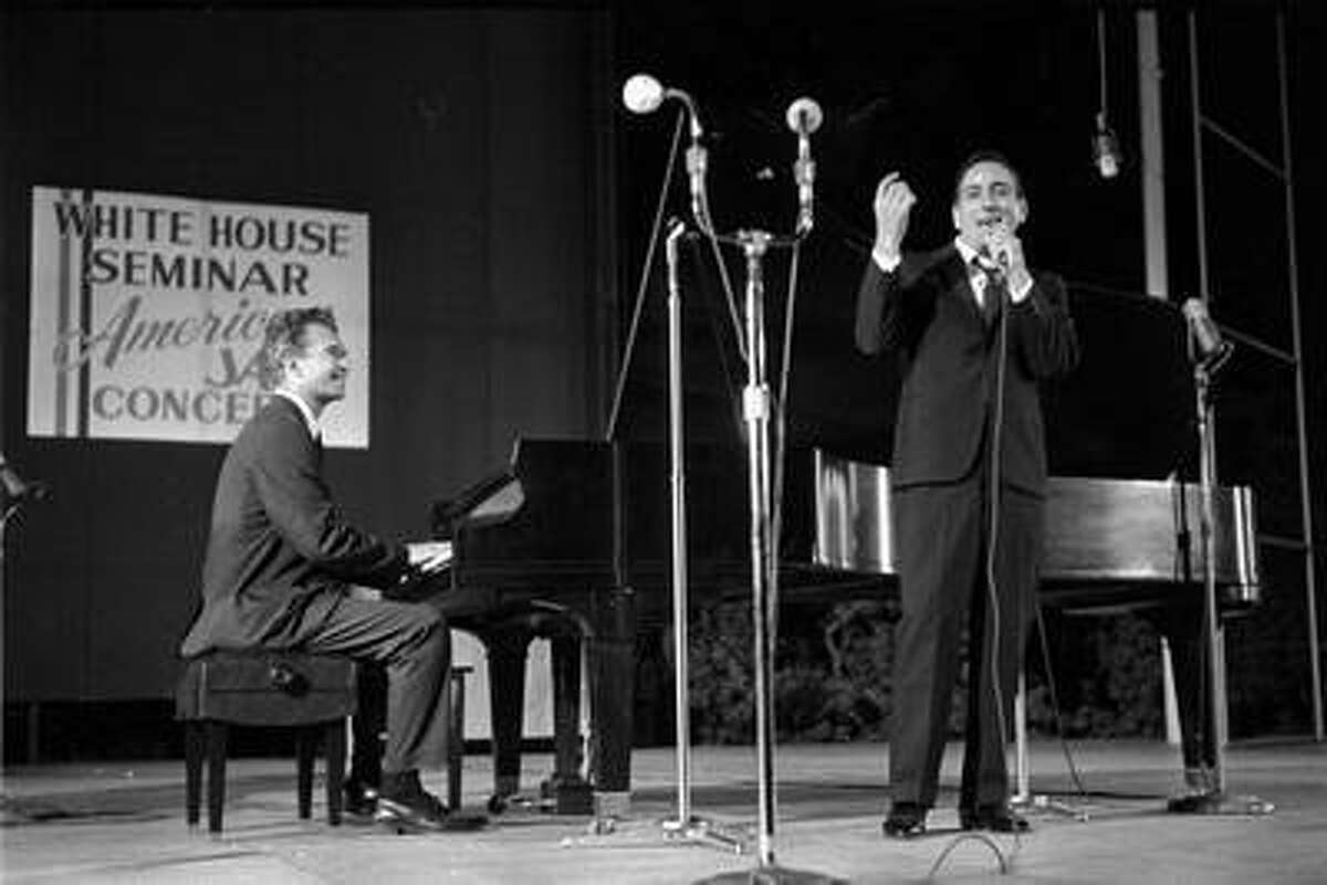 This 1962 photo released by Columbia Legacy shows Dave Brubeck, left, and Tony Bennett performing in Washington. Bennett never forgot the first time he performed with Dave Brubeck more than half a century ago. But the tape of that memorable collaboration between two American jazz masters lay forgotten in a record label's vaults until its discovery by an archivist just weeks after Brubeck's death in December, and it's just been released as "Bennett/Brubeck: The White House Sessions, Live 1962." (AP Photo/Columbia Legacy)