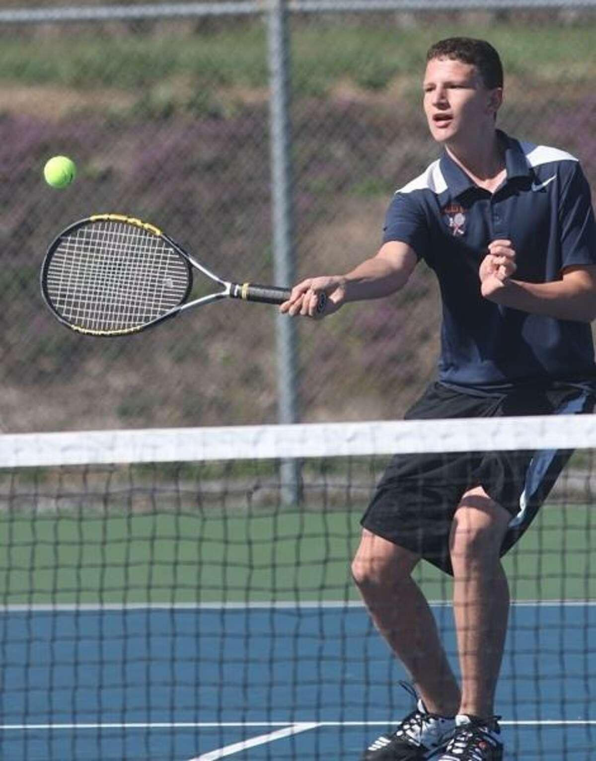 PHOTO BY JOHN HAEGER @ ONEIDAPHOTO ON TWITTER/ONEIDA DAILY DISPATCH Oneida's Jeffrey Coulter returns a shot from Whitesboro's Trevor Kennerknecht during their second singles match at Oneida on Wednesday, April 17, 2013.