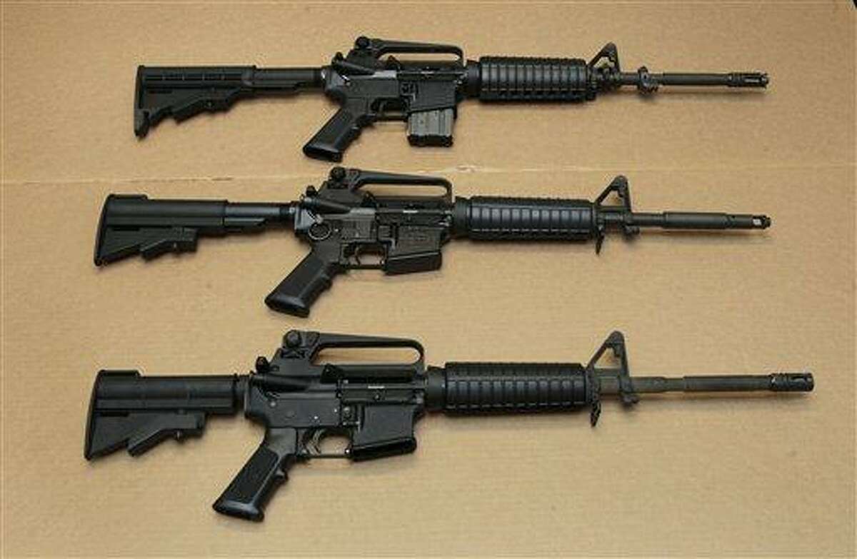 In this Aug. 15, 2012 file photo, three variations of the AR-15 assault rifle are displayed at the California Department of Justice in Sacramento, Calif. AP Photo/Rich Pedroncelli