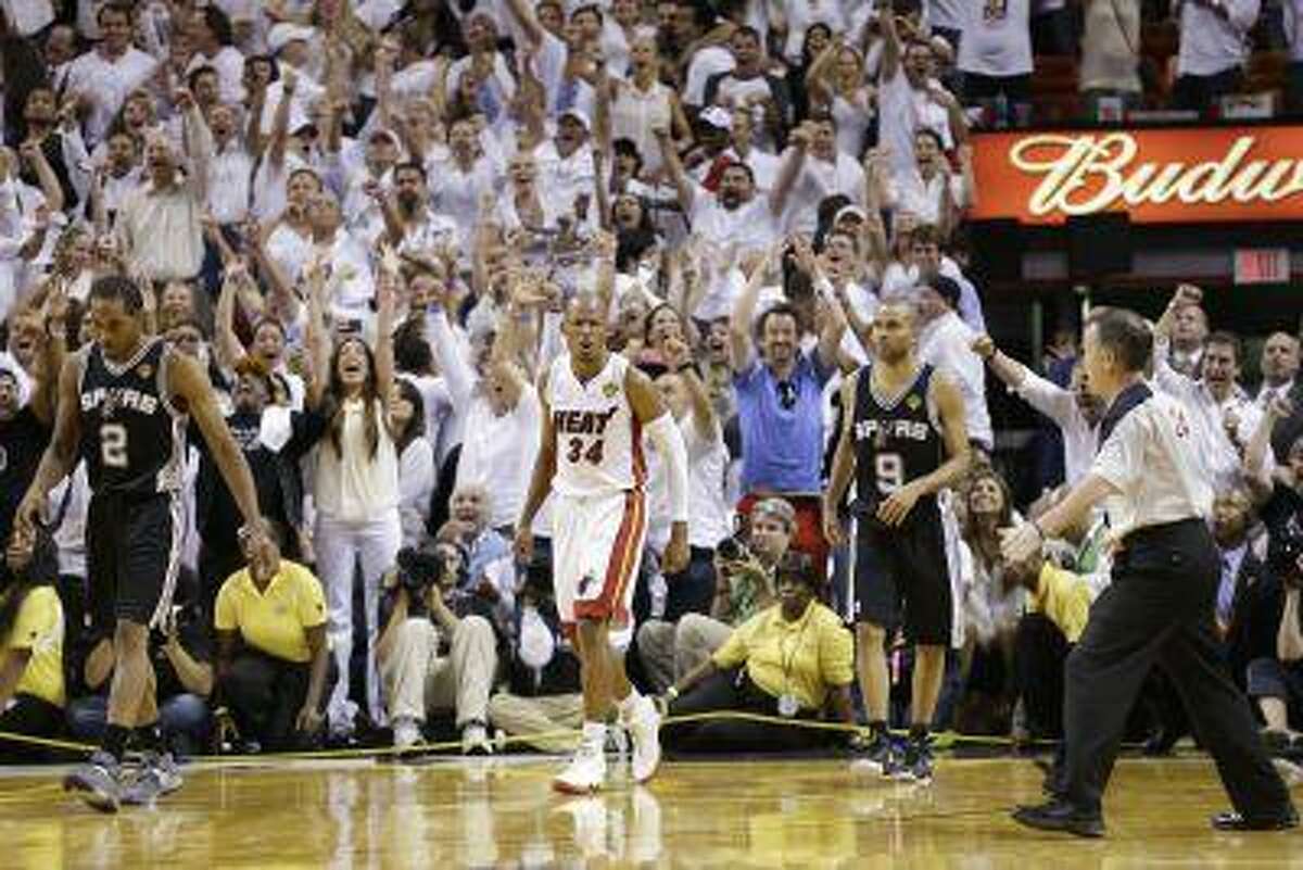 Miami Heat shooting guard Ray Allen (34) reacts to shot that took the game into overtime during the second half of Game 6 of the NBA Finals basketball game against the San Antonio Spurs, Wednesday, June 19, 2013 in Miami. The Miami Heat won 103-100 in overtime.(AP Photo/Lynne Sladky)