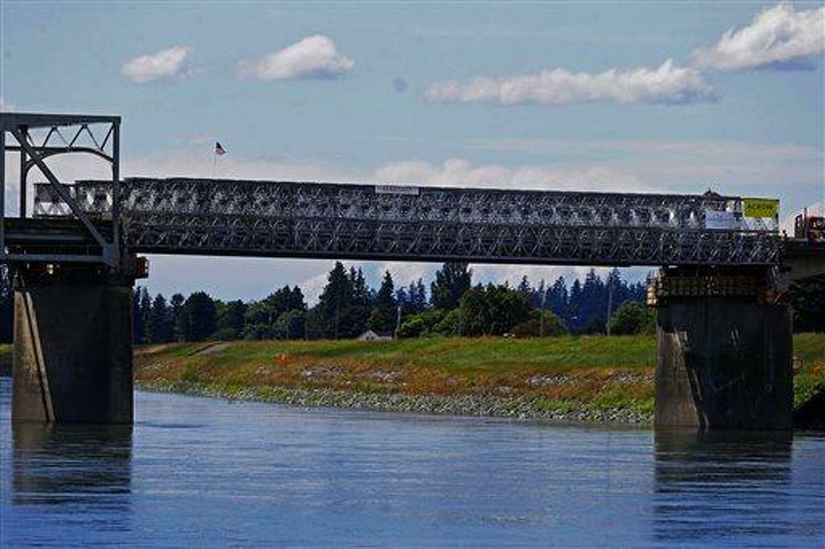This Tuesday, june 18, 2013 photo shows the Interstate 5 bridge over the Skagit river, which is scheduled to reopen tomorrow, Wednesday June 19. (AP Photo/The Seattle Times, Mark Harrison) OUTS: SEATTLE OUT, USA TODAY OUT, MAGAZINES OUT, TELEVISION OUT, SALES OUT. MANDATORY CREDIT TO: MARK HARRISON / THE SEATTLE TIMES