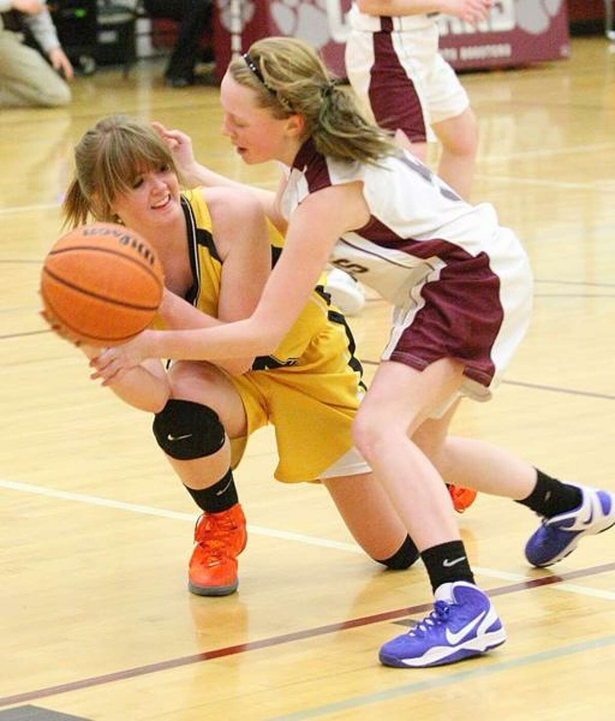 Dispatch Staff Photo by JOHN HAEGER (Twitter: @OneidaPhoto) Otselic Valley's Elyse Peterson (44) and Stockbridge Valley's Jordyn Sanford (5) battle for a loose ball in the first half of their game in Munnsville on Tuesday, Feb. 12, 2013.