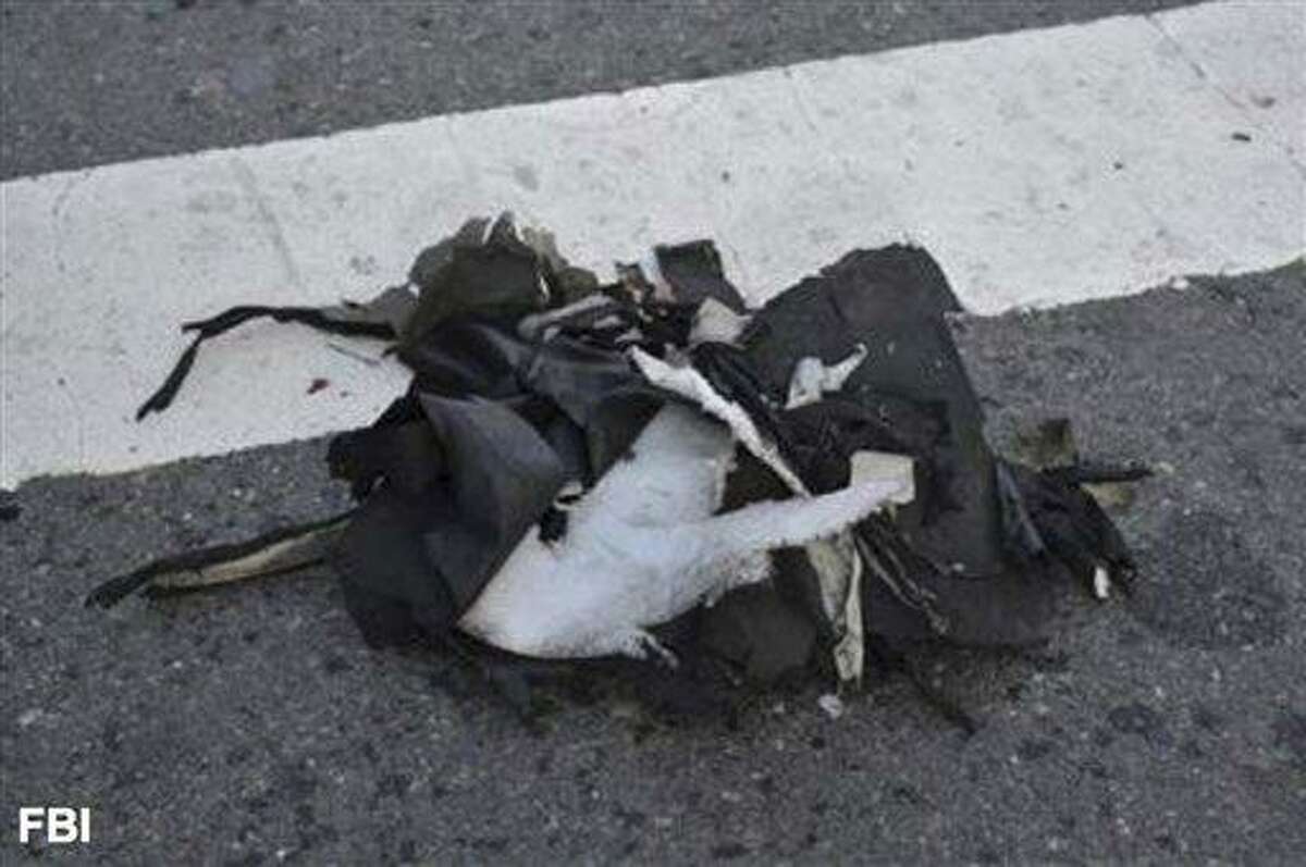 This image from a Federal Bureau of Investigation and Department of Homeland Security joint bulletin issued to law enforcement and obtained by The Associated Press, shows the remains of a black backpack that the FBI says contained one of the bombs that exploded during the Boston Marathon. The FBI says it has evidence that indicates one of the bombs that exploded in the Boston Marathon was contained in a pressure cooker with nails and ball bearings, and it was hidden in a backpack. (AP Photo/FBI)