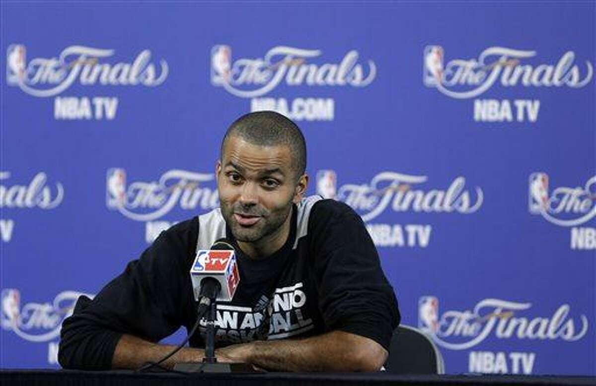San Antonio Spurs point guard Tony Parker, of France, speaks to members of the media during a news conference after NBA basketball practice, Wednesday, June 19, 2013, at the American Airlines Arena in Miami. The Spurs take on the Miami Heat in Game 7 of the NBA Finals on Thursday in Miami. (AP Photo/Wilfredo Lee)