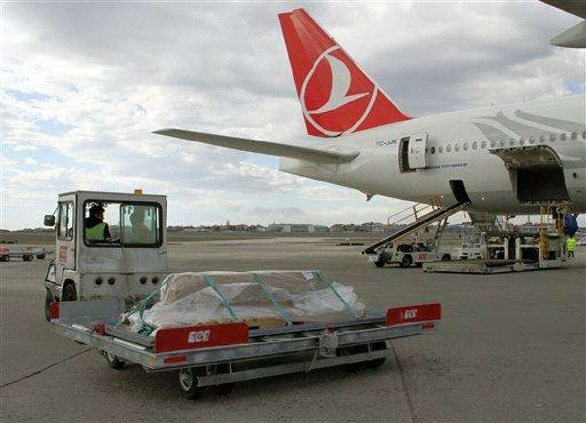 Turkish airport ground service workers load a casket carrying the remains of New York City woman Sarai Sierra, 33, found dead while on a solo vacation in Istanbul, into a plane bound for New York at the Ataturk Airport in Istanbul, Turkey, Thursday, Feb. 7, 2013.(AP Photo/IHA) TURKEY OUT - INTERNET OUT