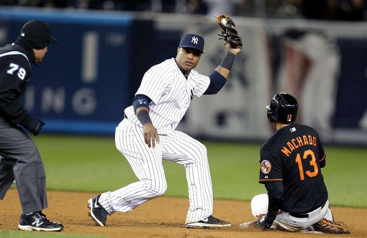 Cano helps M's win in return to Yankee Stadium