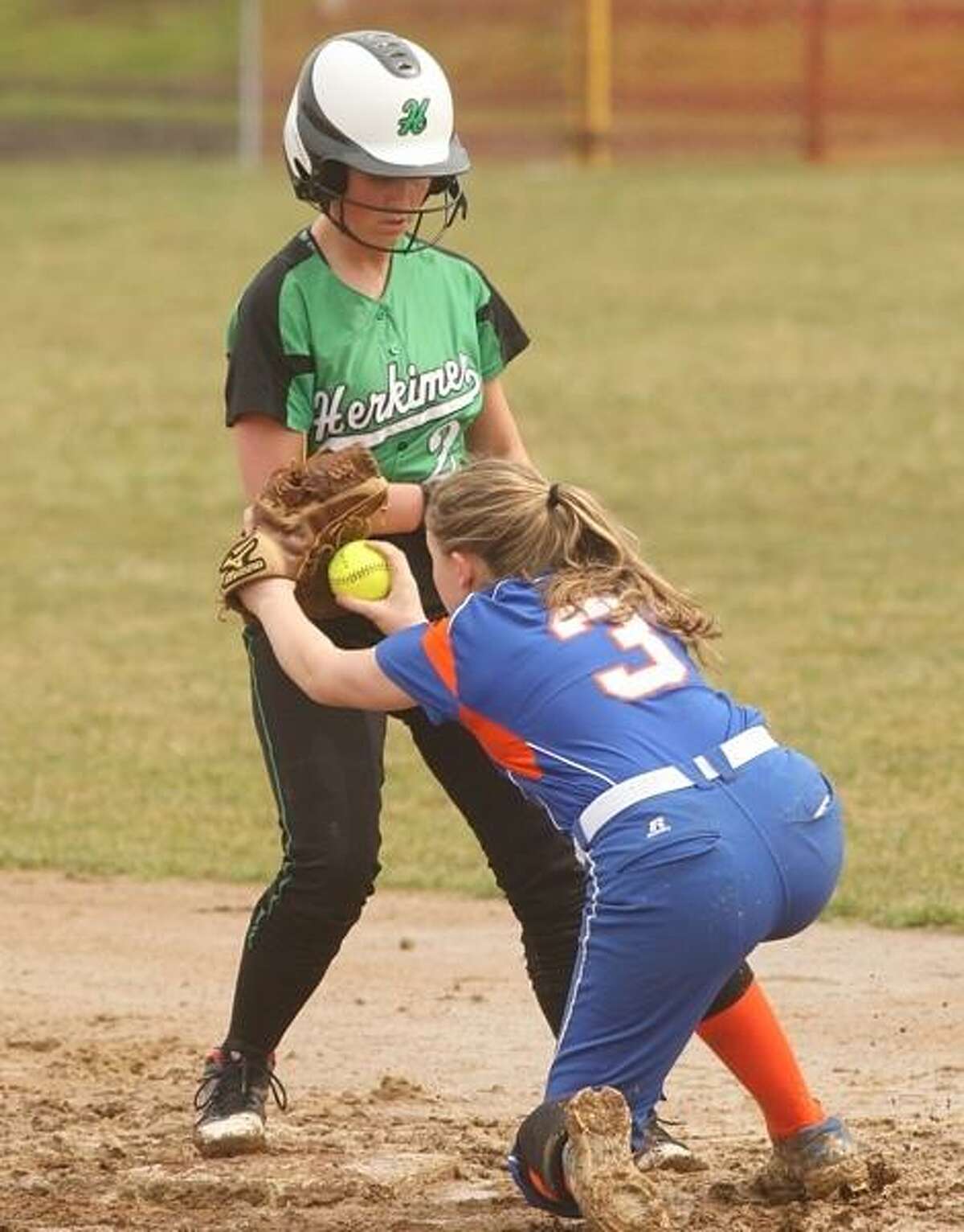 PHOTO BY JOHN HAEGER @ ONEIDAPHOTO ON TWITTER/ONEIDA DAILY DISPATCH Herkimer's Shellbi Morris (2) gets safely back to second before Oneida's Lexi Skibitski (3) can make the tag during their game on Wednesday, April 10, 2013 in Herkimer.