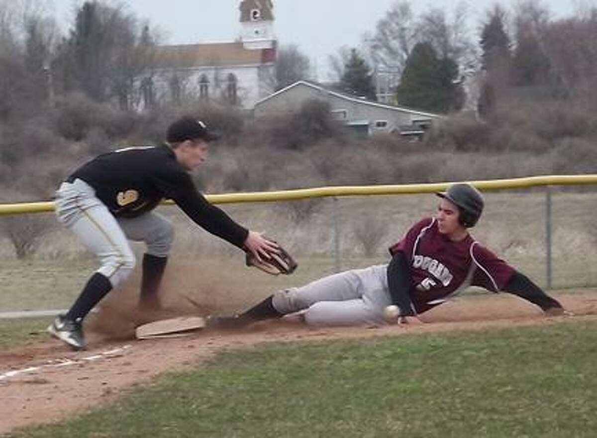 SUBMITTED PHOTO/JACEY POKORNYStockbridge Valley's Brice Jacobs (5) slides safely into third as Otselic Valley's Tyler Armstrong attempts to field the ball during their game in Munnsville on Tuesday, April 9, 2013.