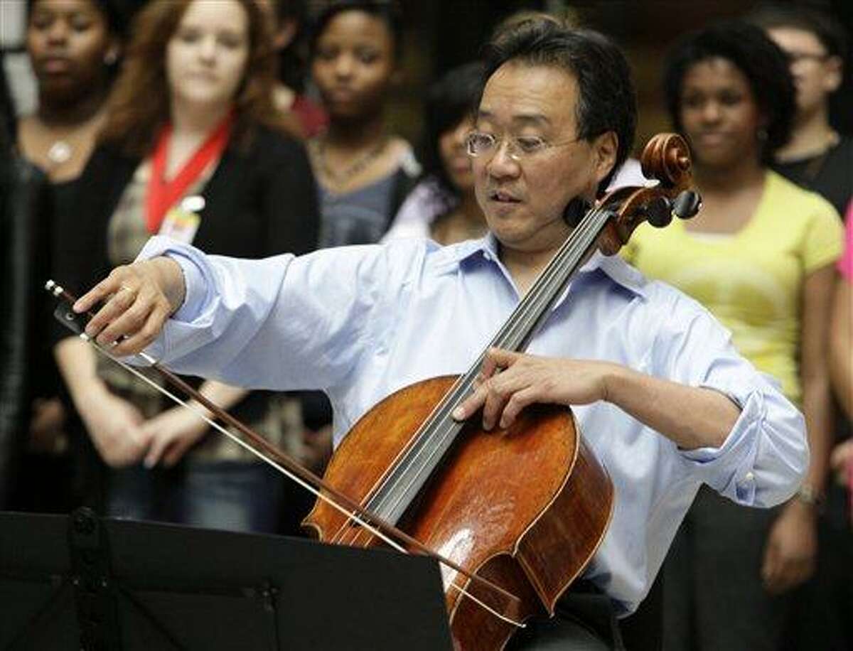 (AP Photo/Kiichiro Sato, File) In this March 19, 2012 file photo, world-famous cellist Yo-Yo Ma plays in the rotunda of the State of Illinois building, the James R. Thompson Center, in Chicago. Yo-Yo Ma and former Guns N' Roses drummer Matt Sorum were on Capitol Hill Tuesday to urge lawmakers to increase funding for the arts in a year of deep federal budget cuts.
