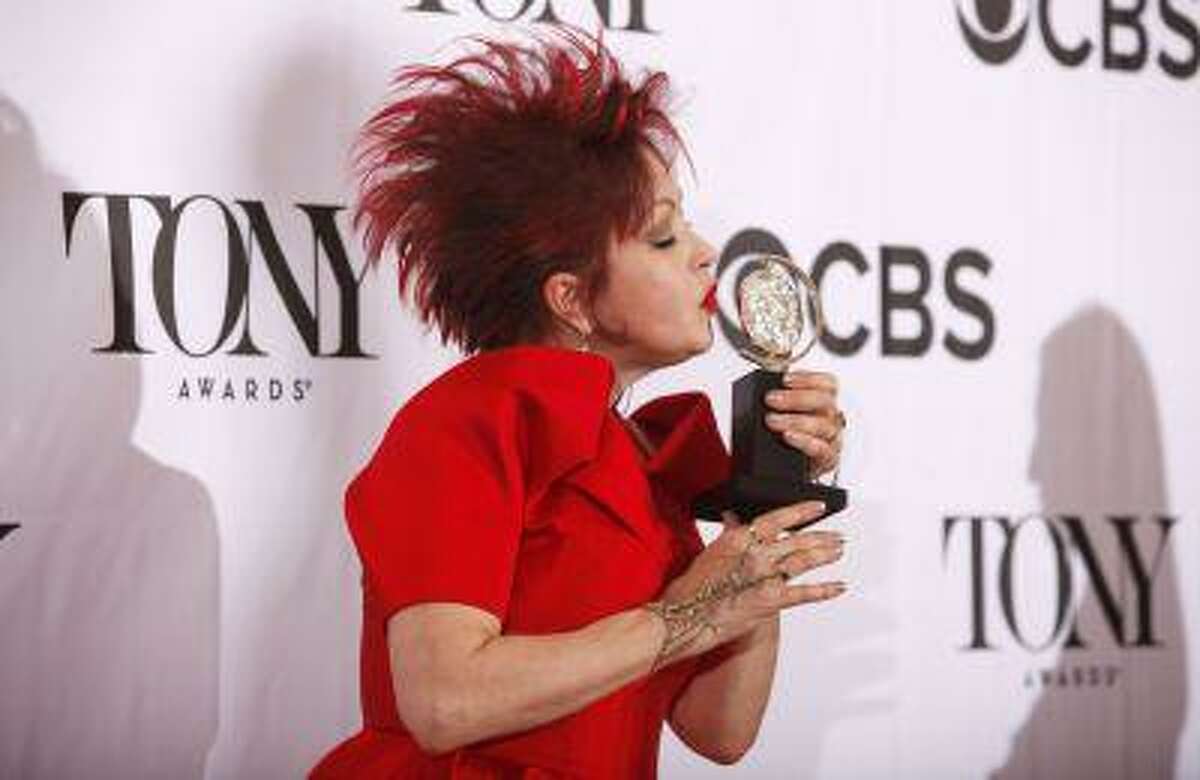Cyndi Lauper poses with her award for Best Original Score (Music and/or Lyrics) Written for the Theatre for " Kinky Boots" at the American Theatre Wing's annual Tony Awards in New York June 9, 2013. REUTERS/Carlo Allegri