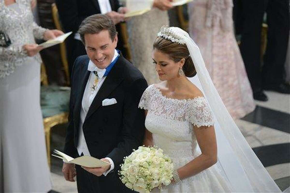 Princess Madeleine of Sweden and Christopher O'Neill during their wedding ceremony at the Royal Chapel in Stockholm, Saturday June 8, 2013. (AP Photo/Fredrik Sandberg) SWEDEN OUT