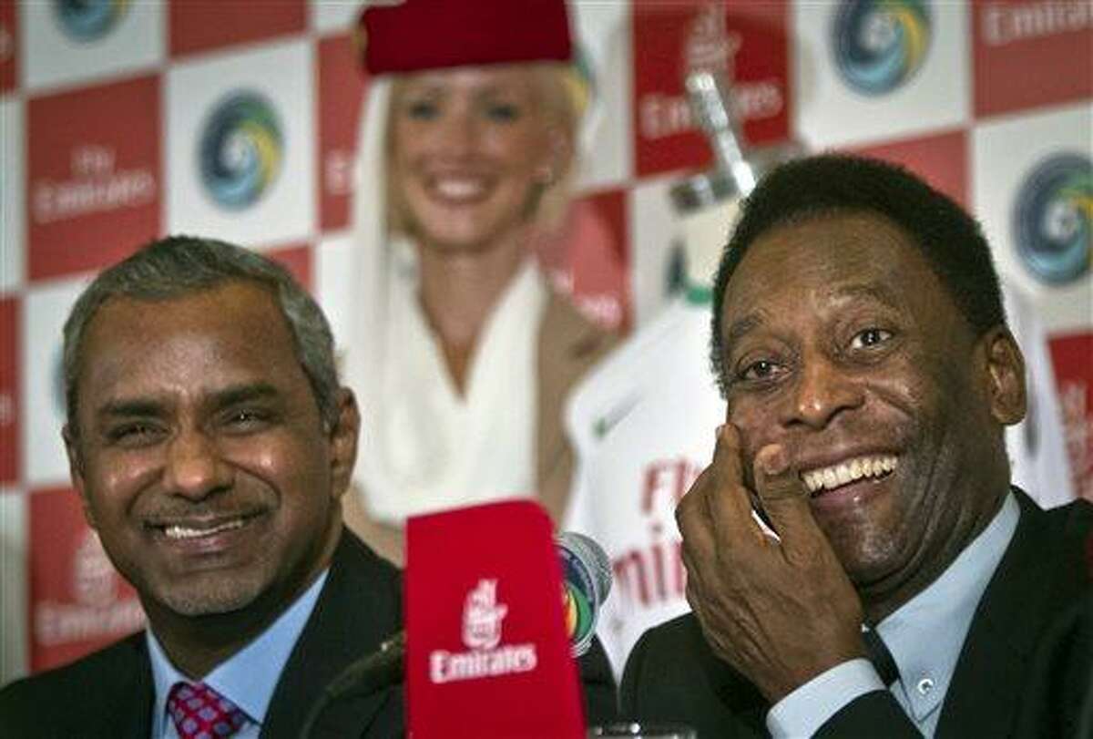 Brazil´s soccer legend Pele, right, and Nabil Sultan, vice president of Emirates Airline, smile during a press conference on Tuesday, June 4, 2013 in New York. Pele, 72, the honorary president of the New York Cosmos soccer club, appeared for the announcement that the revived team signed a sponsorship contract with Emirates Airline, as the team prepares to play in the North American Soccer League this summer. (AP Photo/Bebeto Matthews)