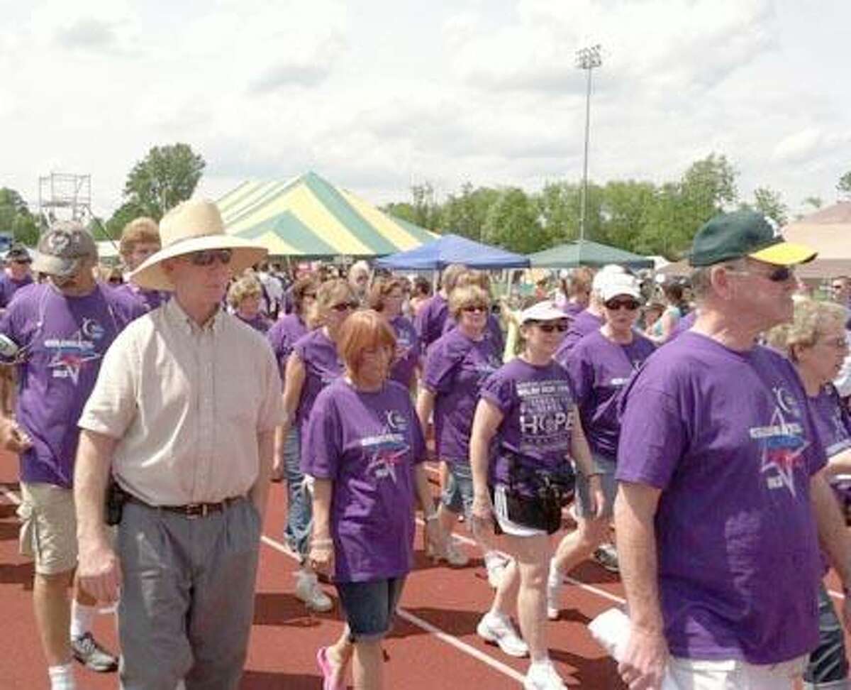 Survivors take a lap at the Madison County Relay for Life Dispatch Staff Photo by Nick Will (Edit)