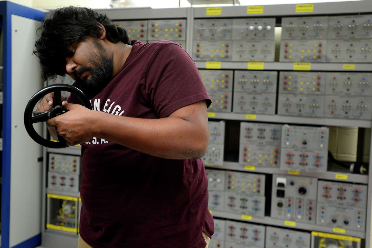 Srikar Venneti, an electrical engineering graduate student at Lamar University, works in the lab on Tuesday. Venneti came to Beaumont from India to get his masters degree. Photo taken Tuesday 7/18/17 Ryan Pelham/The Enterprise