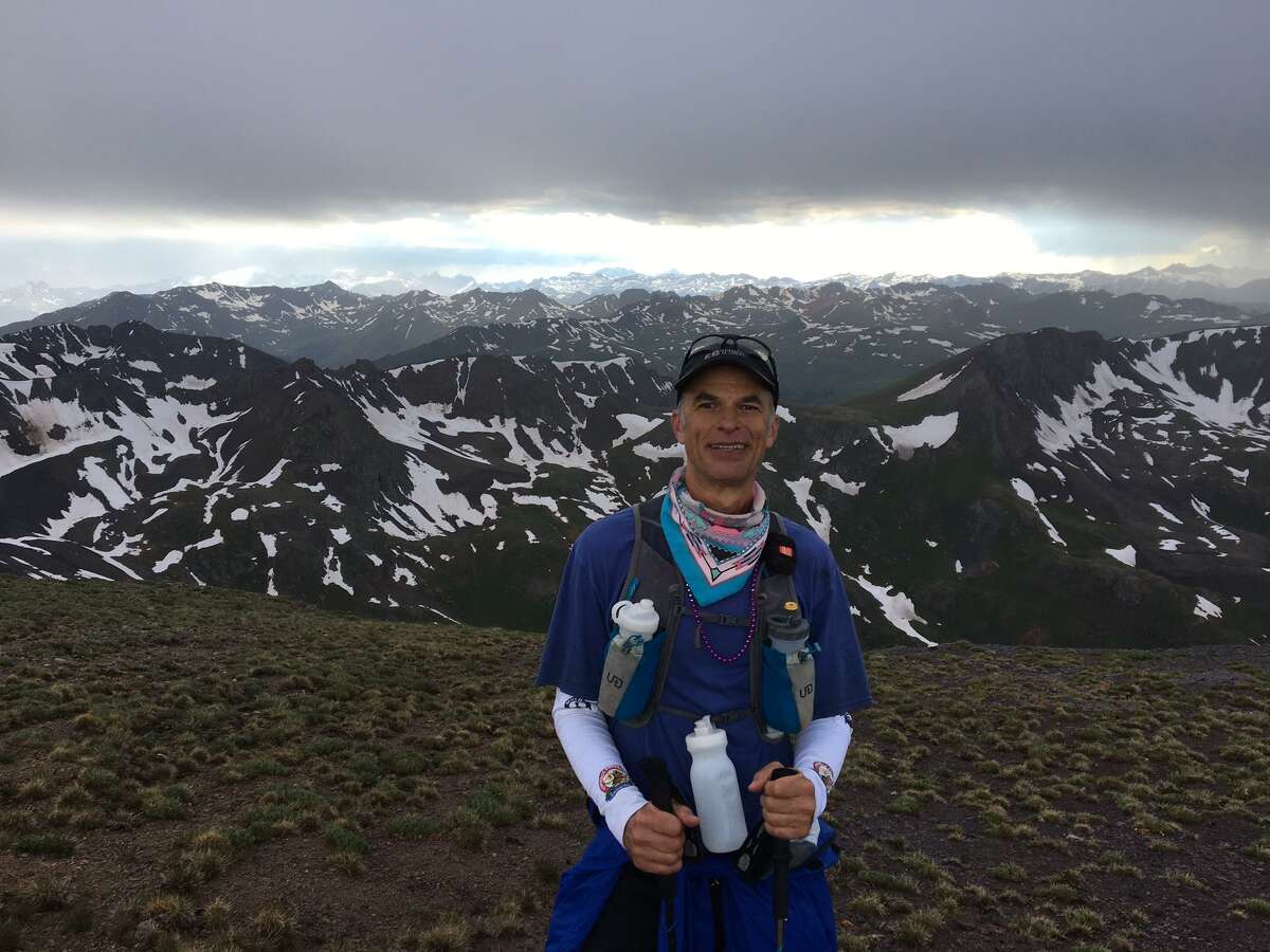 San Antonio professor and ultra-distance runner Tyler Curiel, competing in the Hardrock 100 in southern Colorado’s San Juan Montains, stands at the top of Little Giant, the first major climb, topping 13,000 feet after an over 3,000 vertical feet of climb.