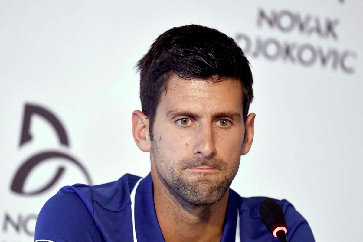 Tennis player Novak Djokovic pauses during a press conference in Belgrade, Serbia, Wednesday, July 26, 2017. Djokovic will sit out the rest of this season because of an injured right elbow, meaning he will miss the U.S. Open and end his streak of participating in 51 consecutive Grand Slam tournaments. (Andrej Isakovic, Pool Photo via AP)