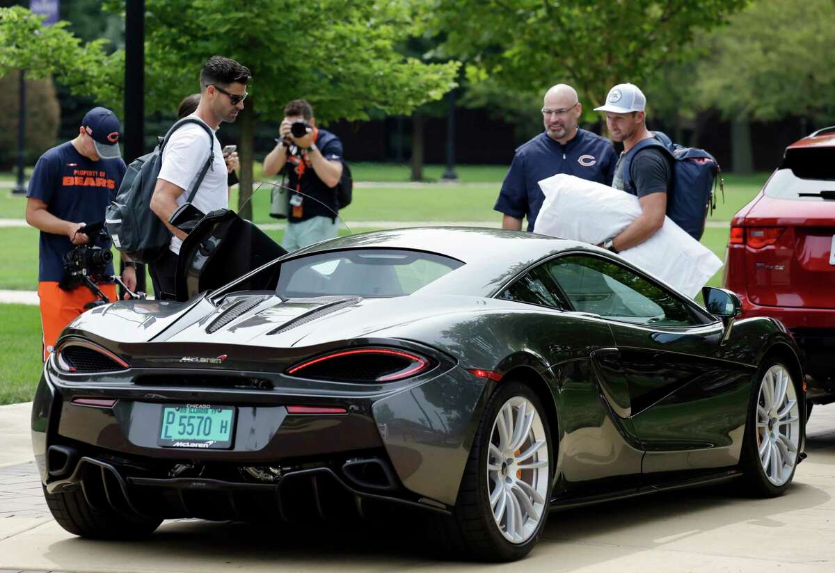 It pays to make it in the NFL, even if you're only seeing the field for a few non-contact plays per game. That was evident at Bears camp on Wednesday as punter Pat O'Donnell, left, and kicker Connor Barth draw attention for arriving in a McLaren, a line of cars whose basic model begins at $180,000.