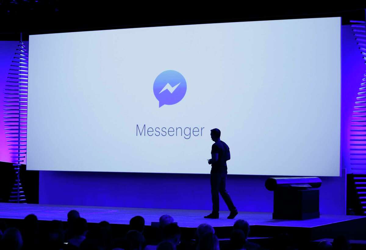 FILE - In this Tuesday, April 12, 2016, file photo, new features of Messenger are displayed during the keynote address at the F8 Facebook Developer Conference in San Francisco. Facebook has squeezed just about as many ads into its main platform as it can. Any more and users might start to complain. Now, ads are moving on to Messenger, and WhatsApp may not be too far behind. (AP Photo/Eric Risberg, File)