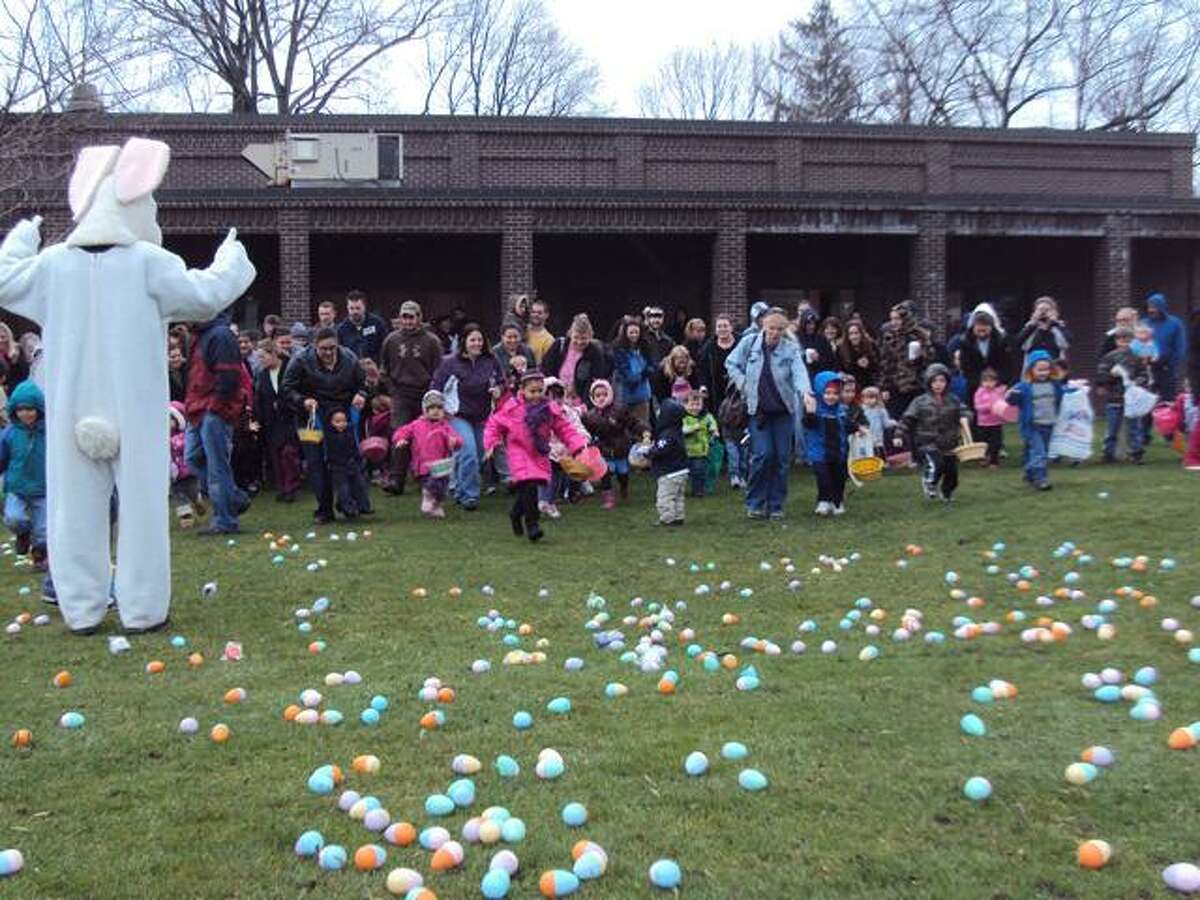 RICKY CAMPBELL/Register Citizen Ready, set, go! Children rush onto the field at Coe Memorial Park to gather candy-filled Easter eggs on Saturday, March 31.
