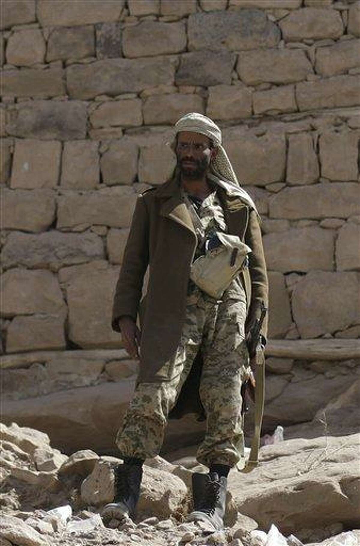 A soldier stands guard outside of Radda Castle, which was recently seized by al-Qaida militants in the town of Radda, 100 miles (160 kilometers) south of the capital, Sanaa, Yemen. A tribal leader involved in negotiating with the militants said al-Qaida militants had withdrawn from Radda, leaving the town in the control of two prominent sheiks. Associated Press