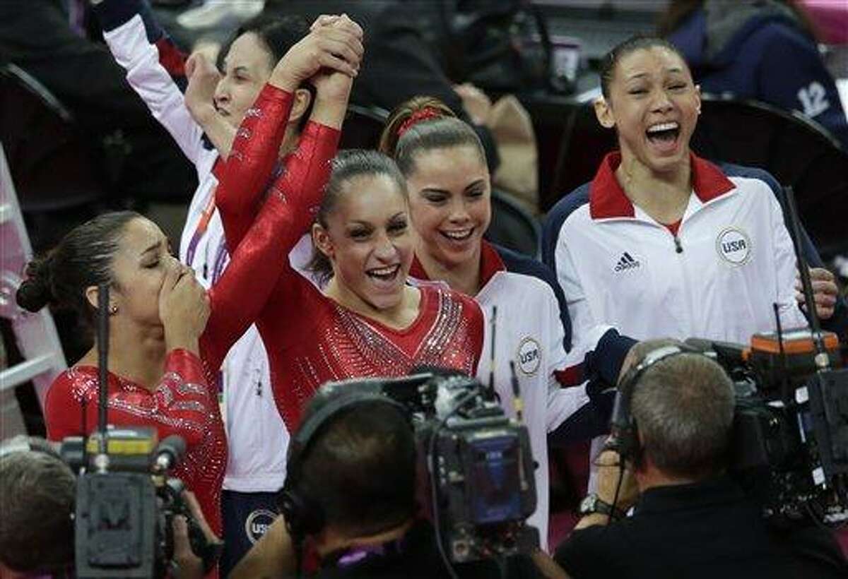 U.S. gymnasts, from left to right, Alexandra Raisman, Jordyn Wieber, McKayla Maroney and Kyla Ross celebrate after being declared winners of the gold medal during the Artistic Gymnastic women's team final Tuesday at the 2012 Summer Olympics in London. Associated Press