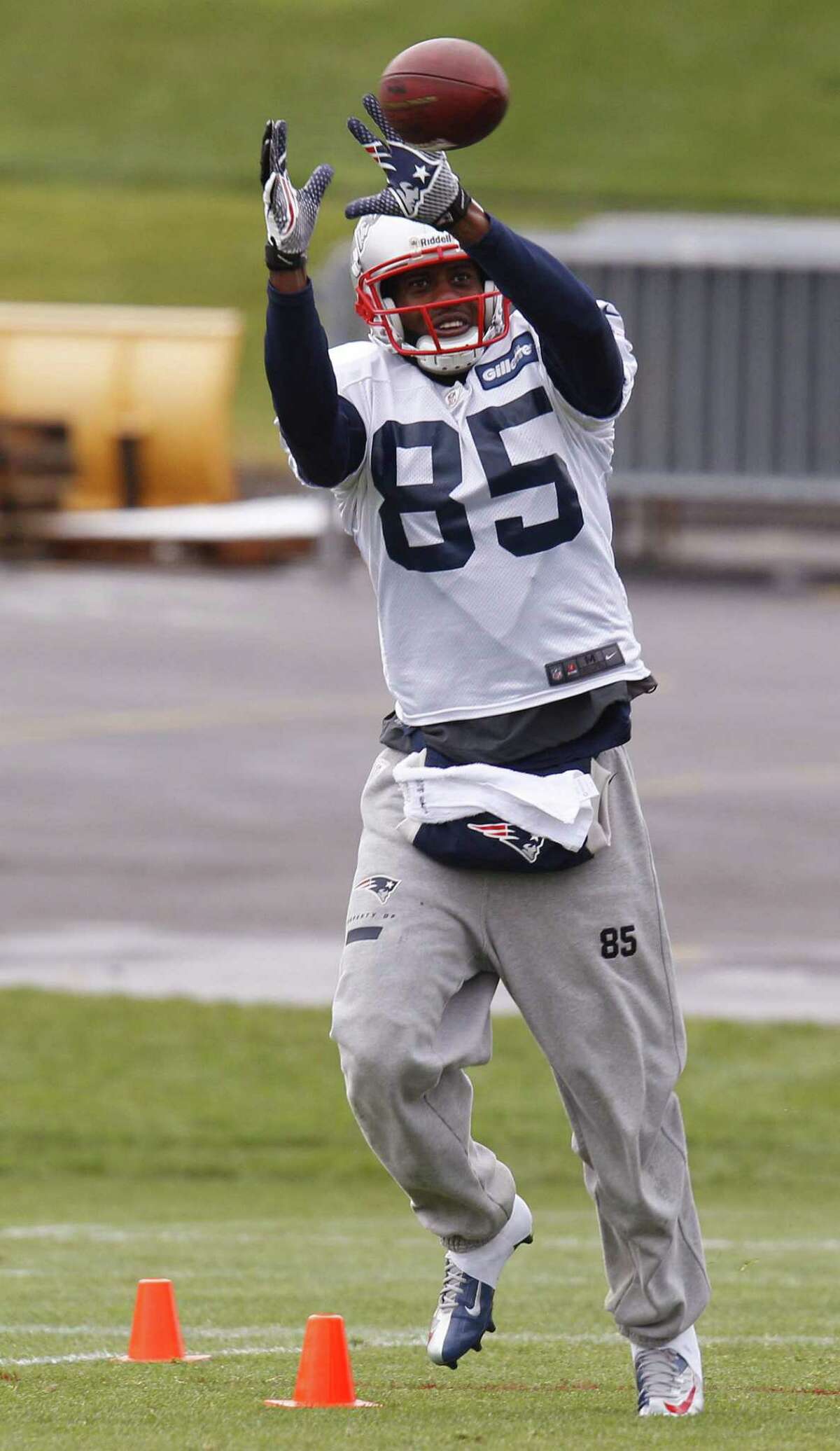 New England Patriots wide receiver Brandon Lloyd (85) catches a pass during practice at the NFL football team's facility in Foxborough, Mass., Wednesday, Nov. 28, 2012. (AP Photo/Stephan Savoia)