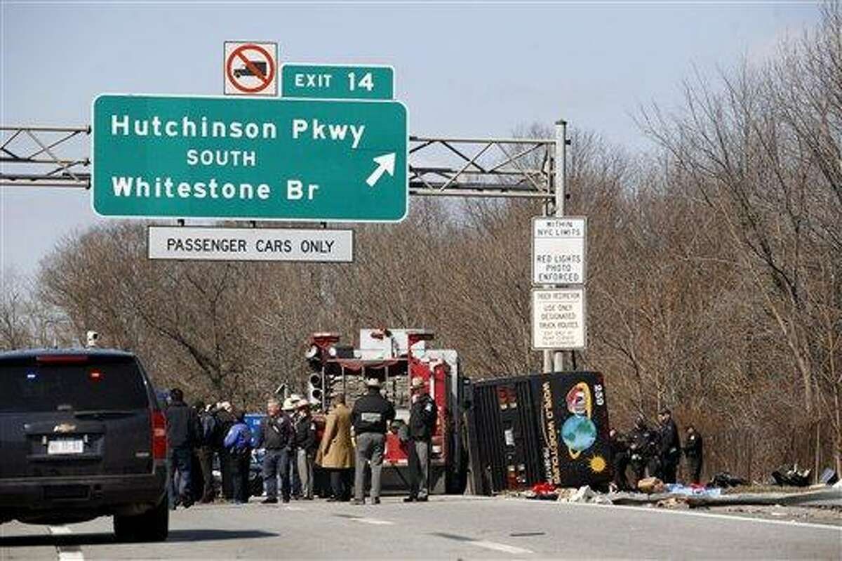 Emergency personnel investigate the scene of a bus crash on I-95 in the Bronx borough of New York in March 2011. Twenty-six bus operations that transported more than 1,800 passengers a day along I-95 between New York and Florida have been closed for safety violations in what federal officials say is the government's largest single safety crackdown of the motor coach industry in at least a decade. Associated Press