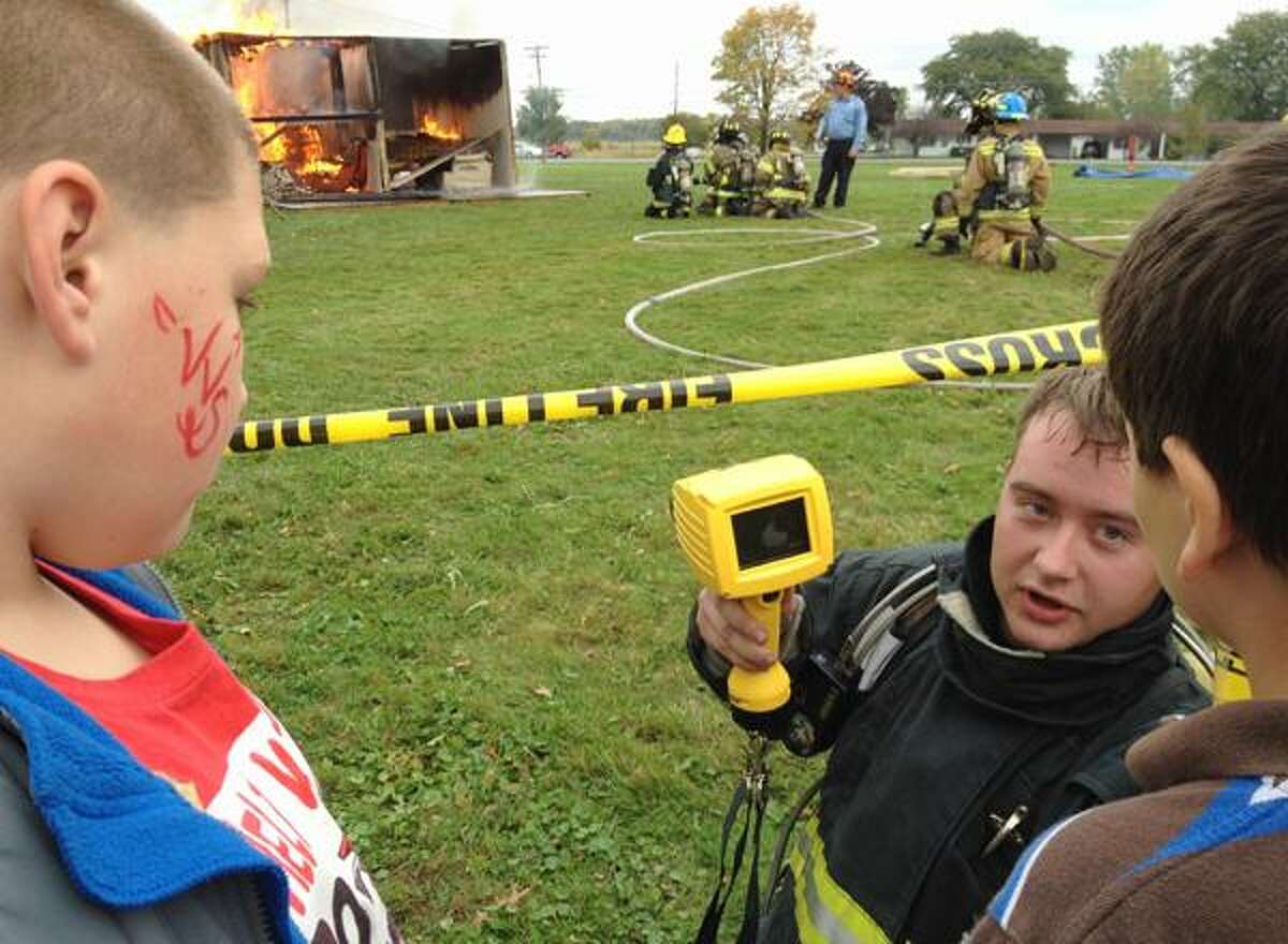Dispatch Staff Photo by JOHN HAEGER twitter.com/oneidaphoto Sherrill firefighter Casey Cossitt-Yager show the thermal Imaging Camera during the live burn demonstration during the annual VVS Community Day on Sunday, Sept. 30, 2012 in Verona.
