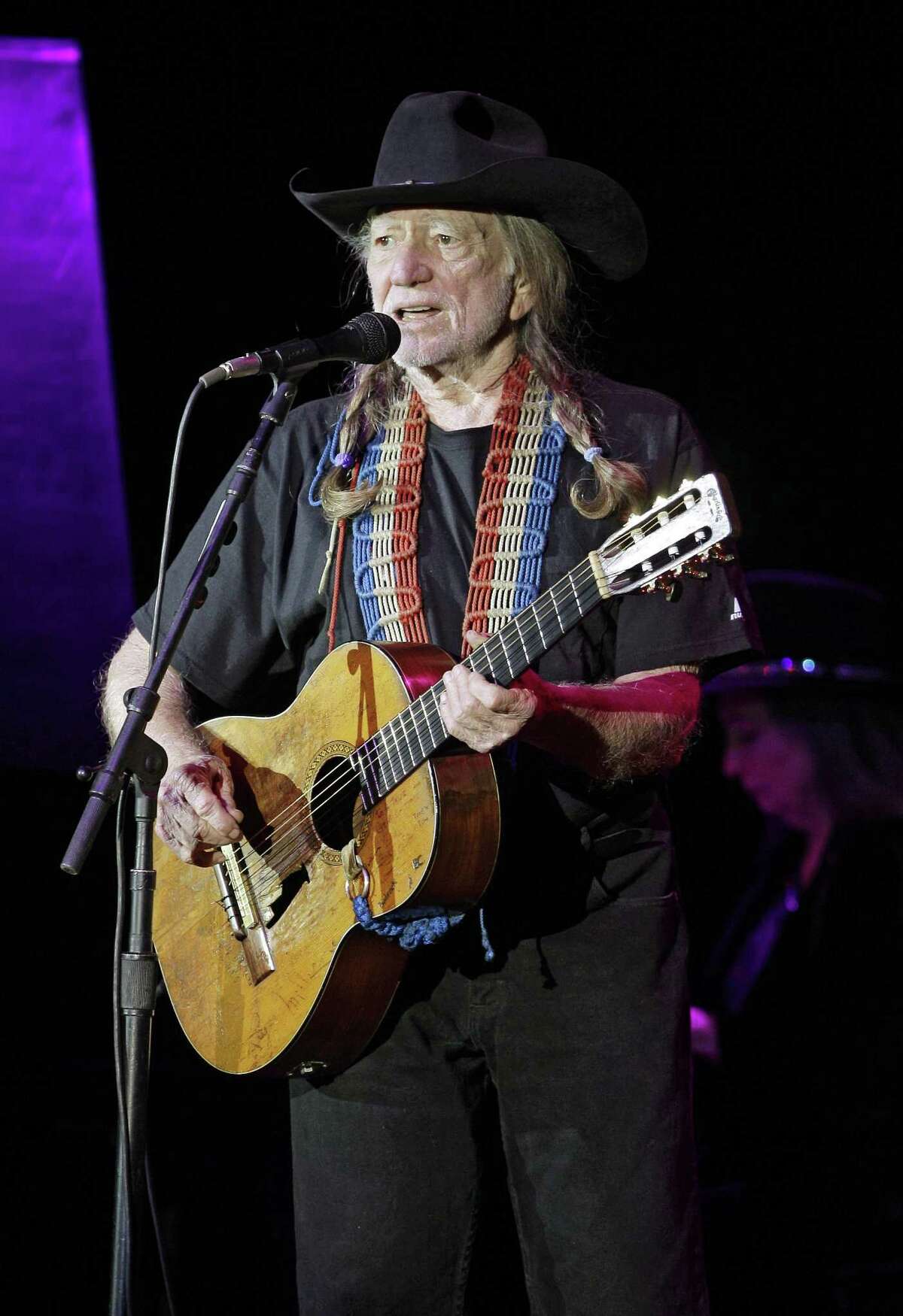 Country music icon Willie Nelson performs during a fundraising concert for U.S. Rep. Dennis Kucinich, D-Ohio, in Lorain, Ohio Sunday, Jan. 29, 2012. Redistricting has pitted Kucinich, a Cleveland Democrat, against Toledo area congresswoman Marcy Kaptur in the March primary. (AP Photo/Mark Duncan)