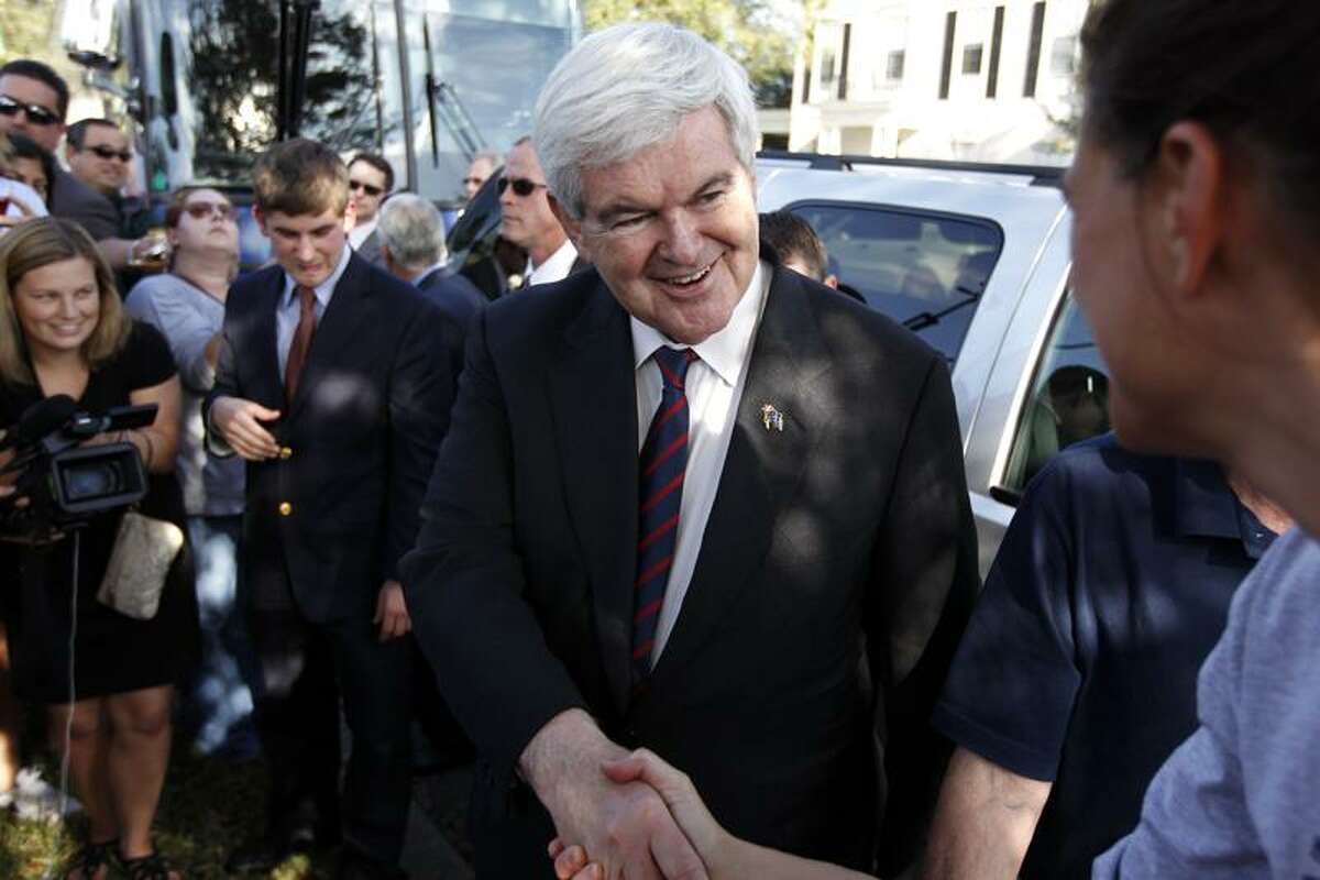 Republican presidential candidate, former House Speaker Newt Gingrich meets with supporters during a visit to a polling place at Celebration Heritage Hall in Celebration, Fla., Tuesday. Associated Press